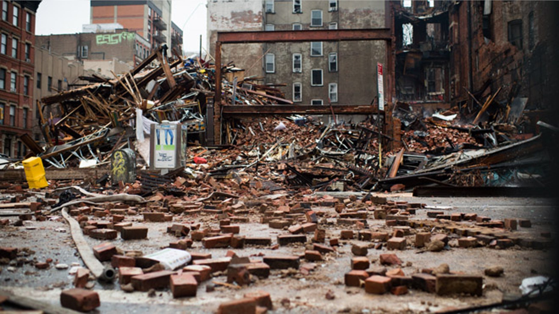 A pile of debris remains at the site of a building explosion in the East Village neighborhood of New York, Friday, March 27, 2015. Nineteen people were injured, four critically, after the powerful blast and fire sent flames soaring and debris flying Thursday afternoon. Preliminary evidence suggested that a gas explosion amid plumbing and gas work inside the building was to blame. (AP Photo/The New York Times, Nancy Borowick, Pool)