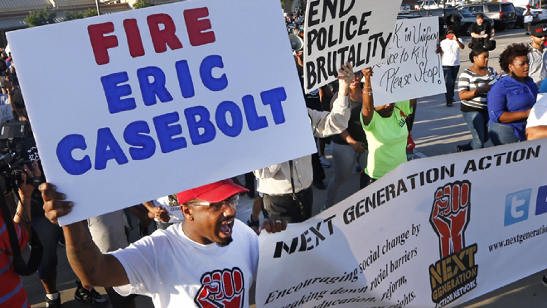 Protestors march Monday, June 8, 2015, during a demonstration in response to an incident at a community pool involving McKinney police officers in McKinney, Texas. (AP Photo/Ron Jenkins)