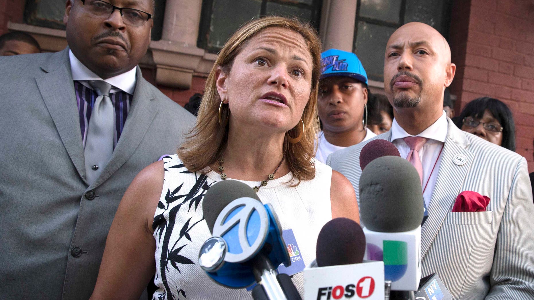 City Council Speaker Melissa Mark-Viverito, center, speaks to the media during a vigil demanding justice for Eric Garner in the Staten Island borough of New York, near where New York City police attempted to arrest Garner, who died as a result of his treatment. Mark-Viverito is stepping out of the shadow of ally Mayor Bill de Blasio and is taking a strides onto the national stage, particularly on issues such as immigration and criminal justice reform. (AP Photo/John Minchillo, File)