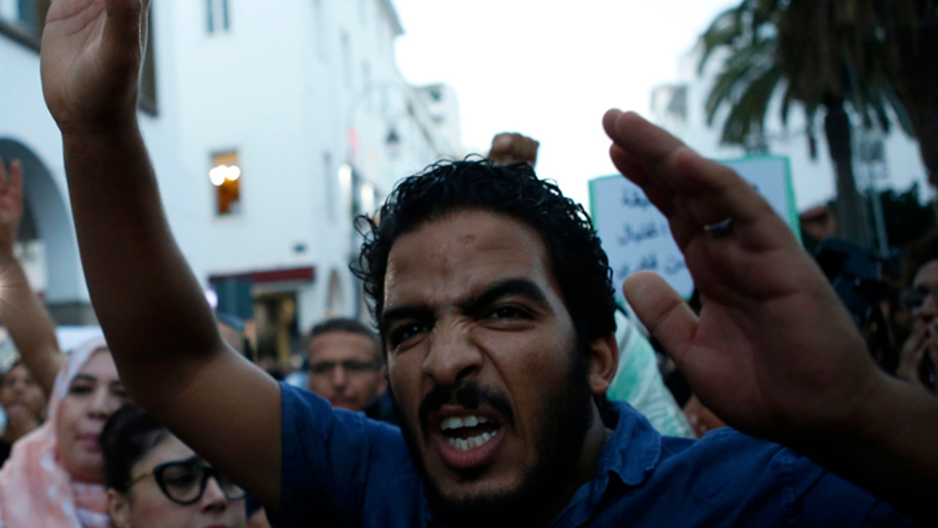 A Moroccan shouts as thousands of Moroccans protest against Fikri's death last Friday in the northern city of Hoceima in Rabat, Morocco