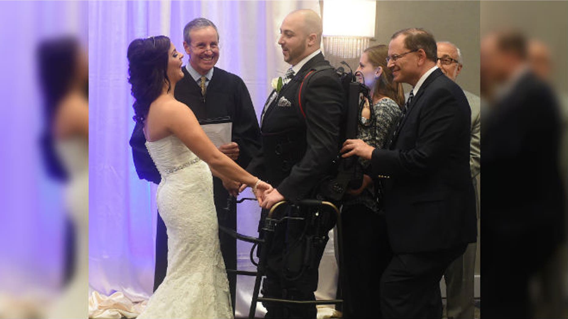 Jordan Basile, left, and Matt Ficarra, center, exchange wedding vows Saturday, Oct. 18, 2014, at the Doubletree hotel in Syracuse, N.Y. (AP Photo/The Syracuse Newspapers, Dennis Nett)