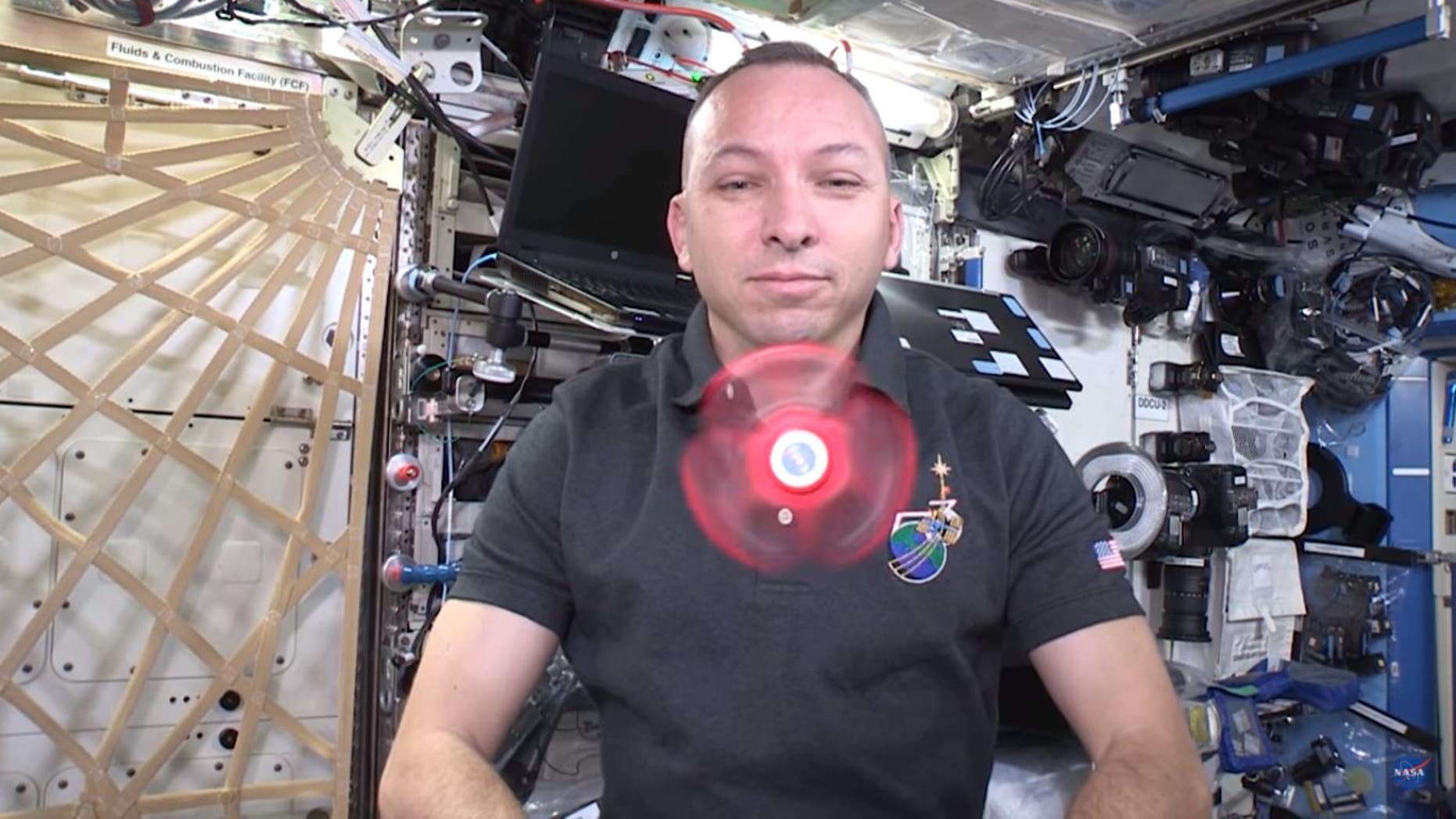 NASA astronaut Randy Bresnik plays with a fidget spinner on the International Space Station.