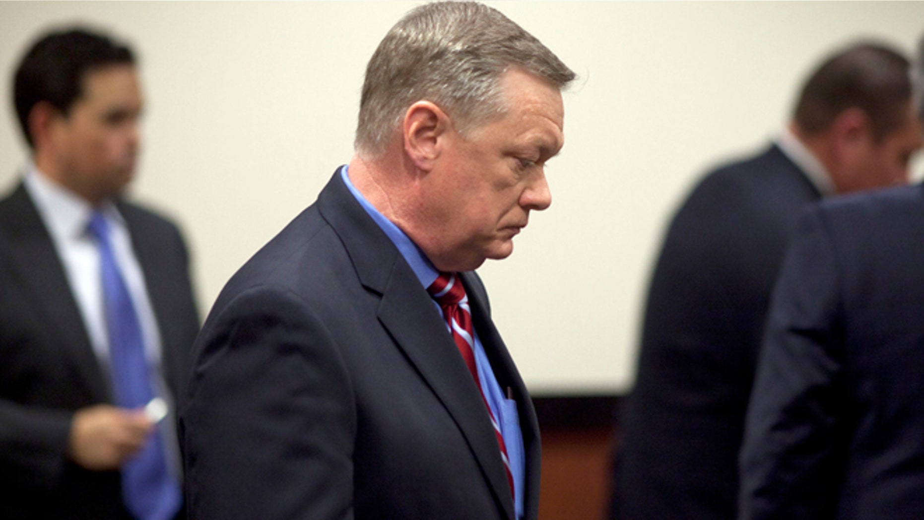 Feb. 21, 2013: In this file photo, Former Fiesta Bowl CEO John Junker appears in Maricopa County Superior Court in Phoenix, Ariz.
