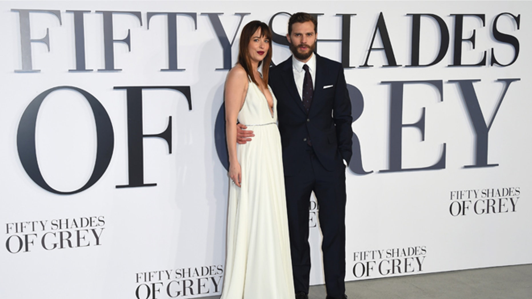 Feb. 12, 2015. Dakota Johnson and Jamie Dornan pose for photographers at the UK Premiere of "Fifty Shades of Grey."