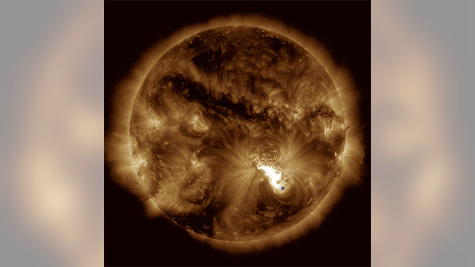 Major eruption of Oct. 24, 2014, observed by the AIA instrument of the NASA Solar Dynamics Observatory mission. Earth was added for scale.