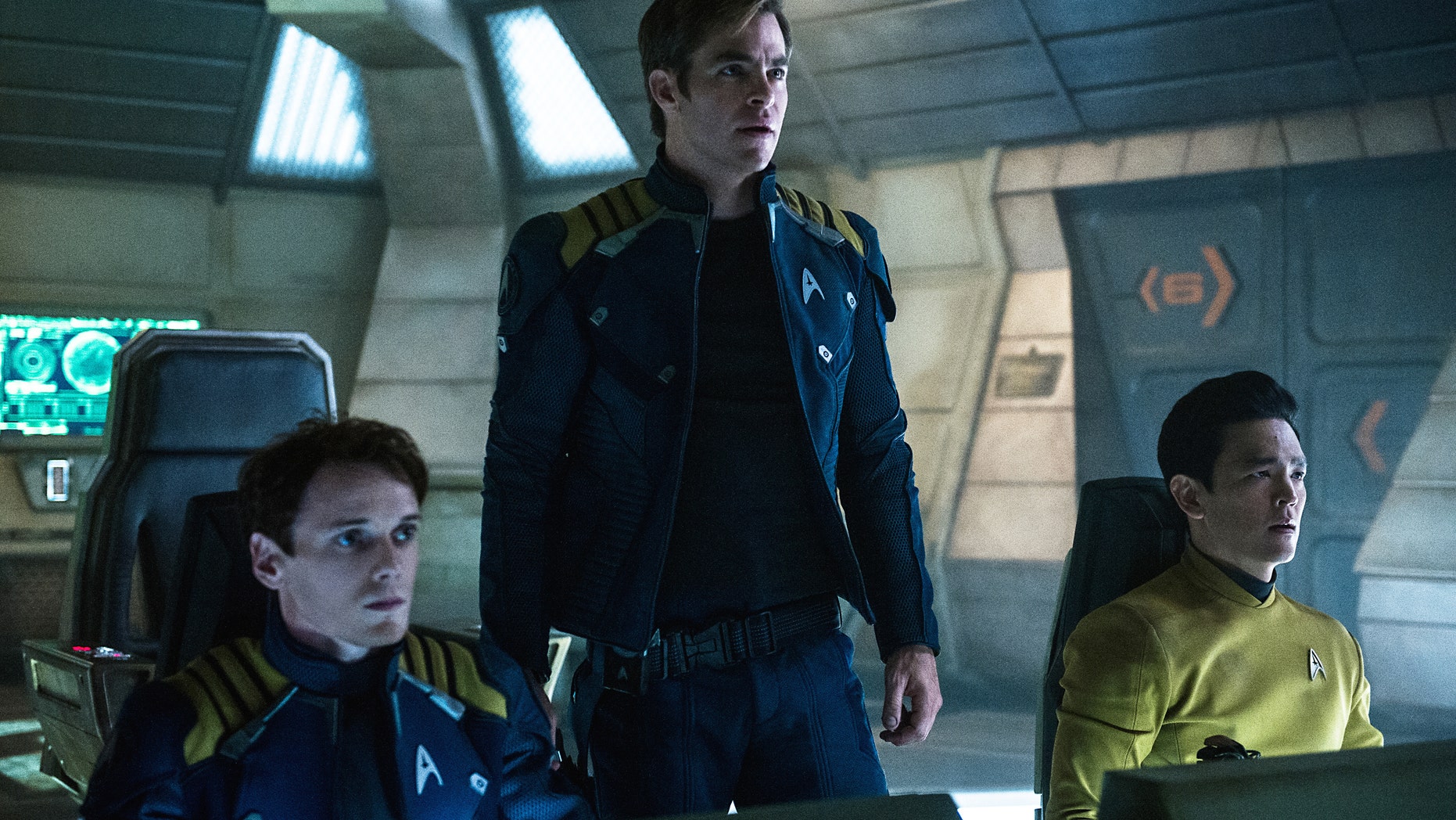 In this image released by Paramount Pictures, from left, Anton Yelchin, Chris Pine and John Cho appear in a scene from, "Star Trek Beyond."