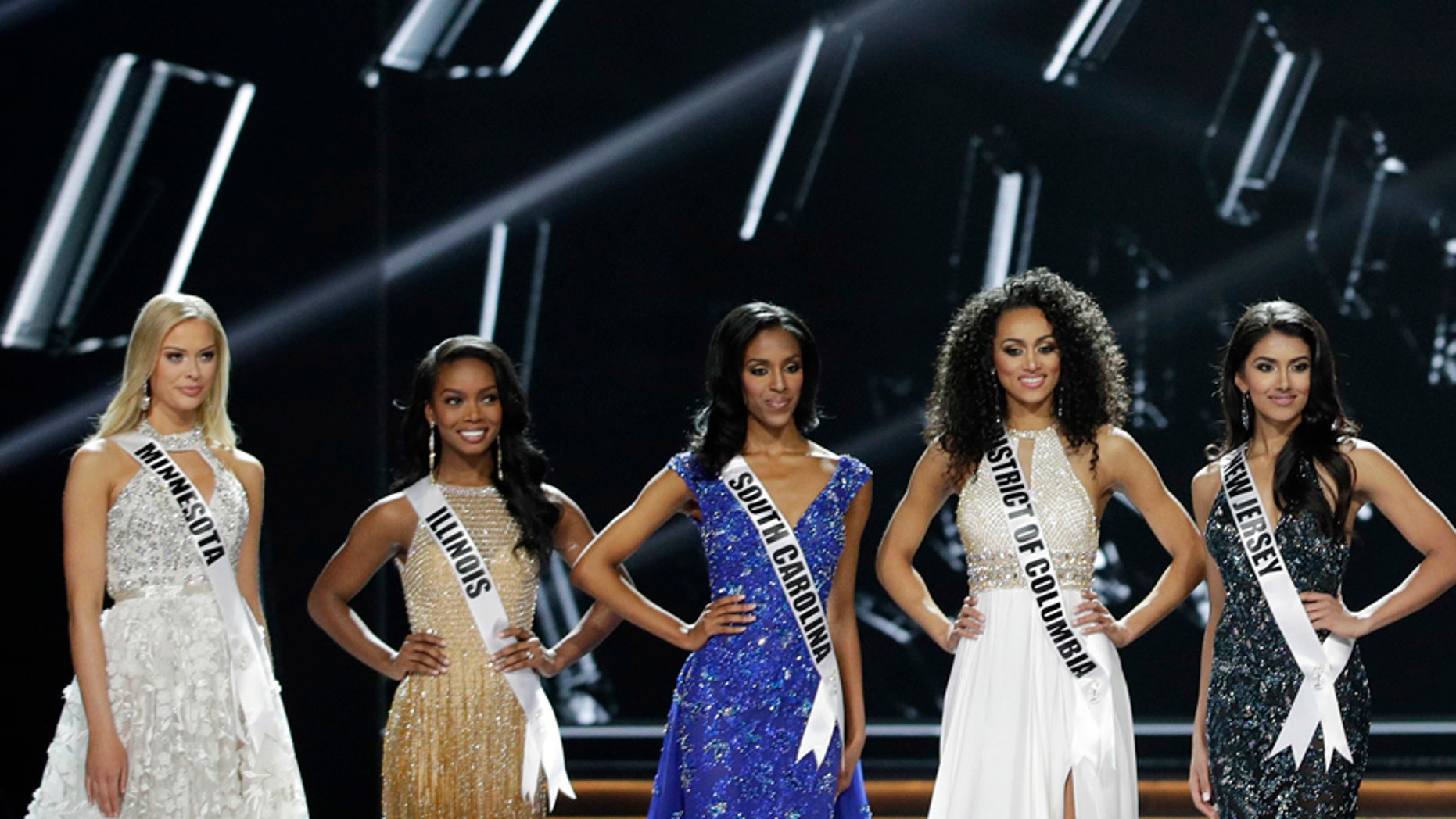 The final five contestants stand on stage during the Miss USA contest Sunday, May 14, 2017, in Las Vegas.