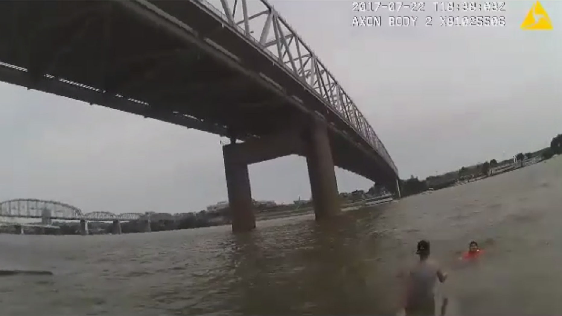 Police rescue a woman after her wheelchair rolled into the Ohio River.