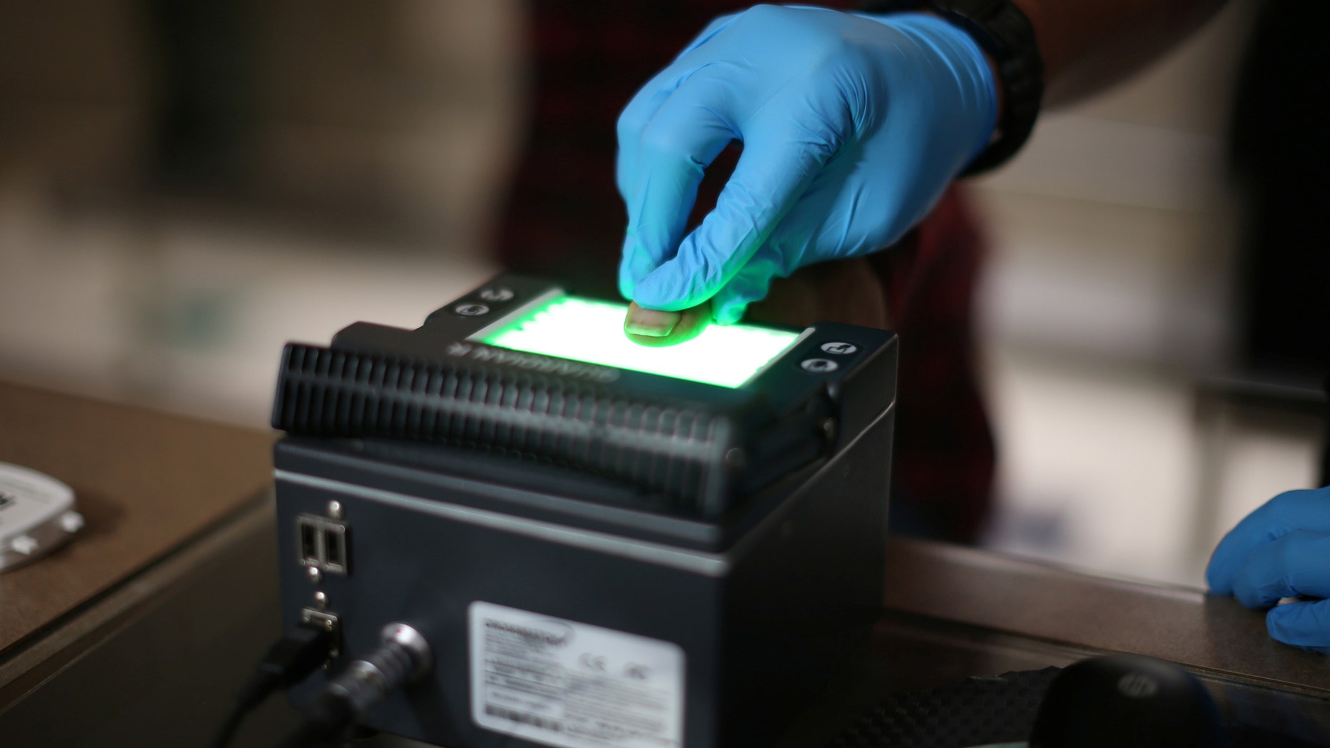File photo: Mexican national Adalberto Magana-Gonzalez, 44, has his fingerprints taken after being taken into custody by a U.S. Immigration and Customs Enforcement's (ICE) Fugitive Operations team in Santa Ana, California, U.S., May 11, 2017. (REUTERS/Lucy Nicholson)
