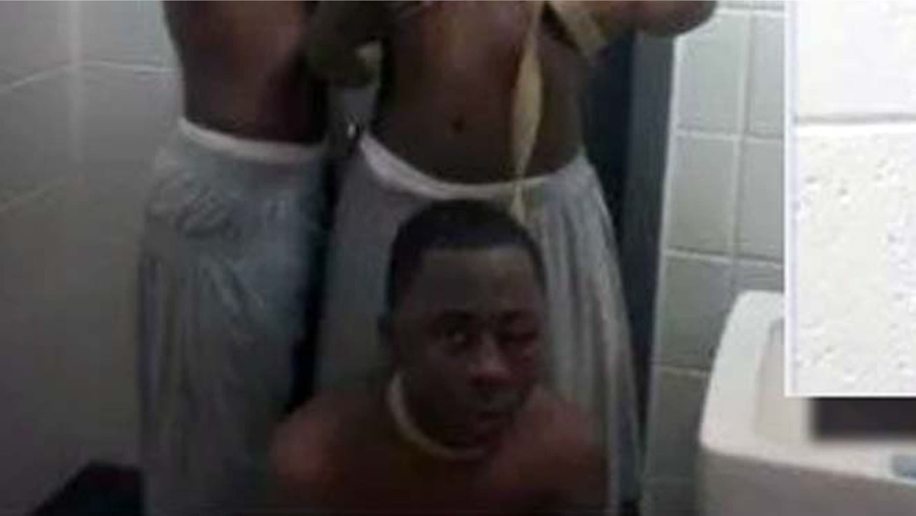 Prison officials in Georgia are investigating a photograph that emerged on Facebook that reportedly shows an inmate with a swollen face wearing a leash.