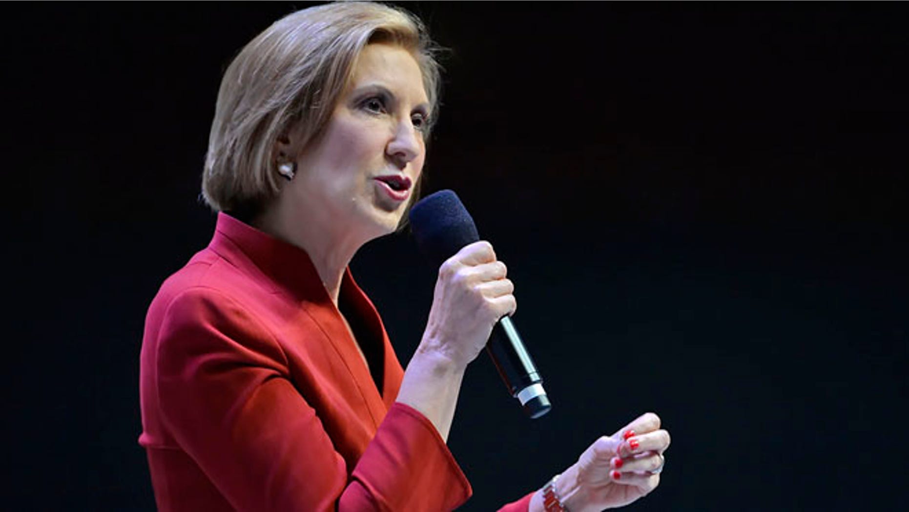 Republican presidential candidate Carly Fiorina speaks at a presidential forum sponsored by Heritage Action at the Bon Secours Wellness Arena, Friday, Sept. 18, 2015, in Greenville, S.C. (AP Photo/Richard Shiro)
