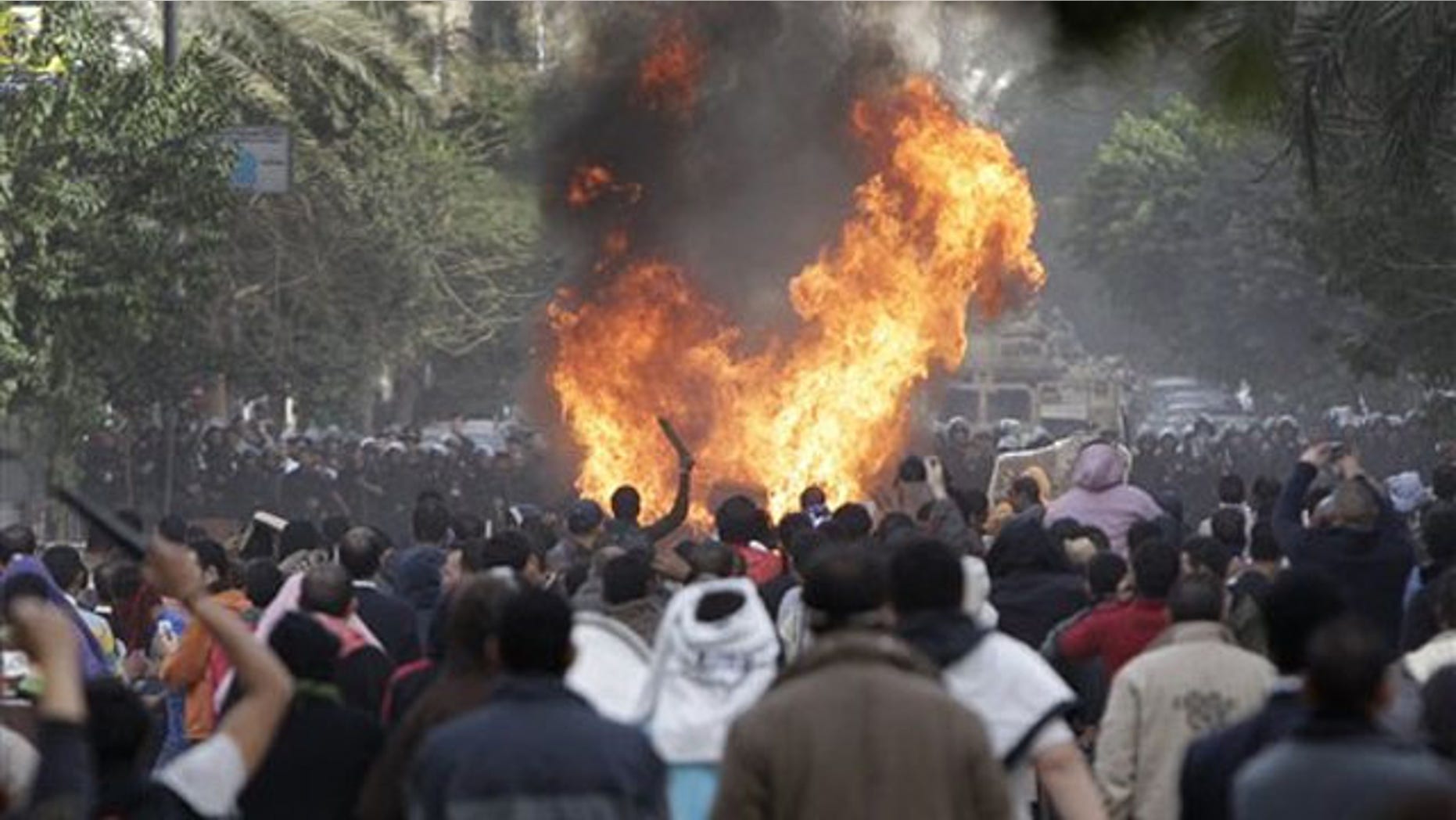 Protesters throw firebombs at riot police after police shot at protesters accompanying the funeral procession of an anti-government protester in downtown Cairo, Egypt, Jan. 29.