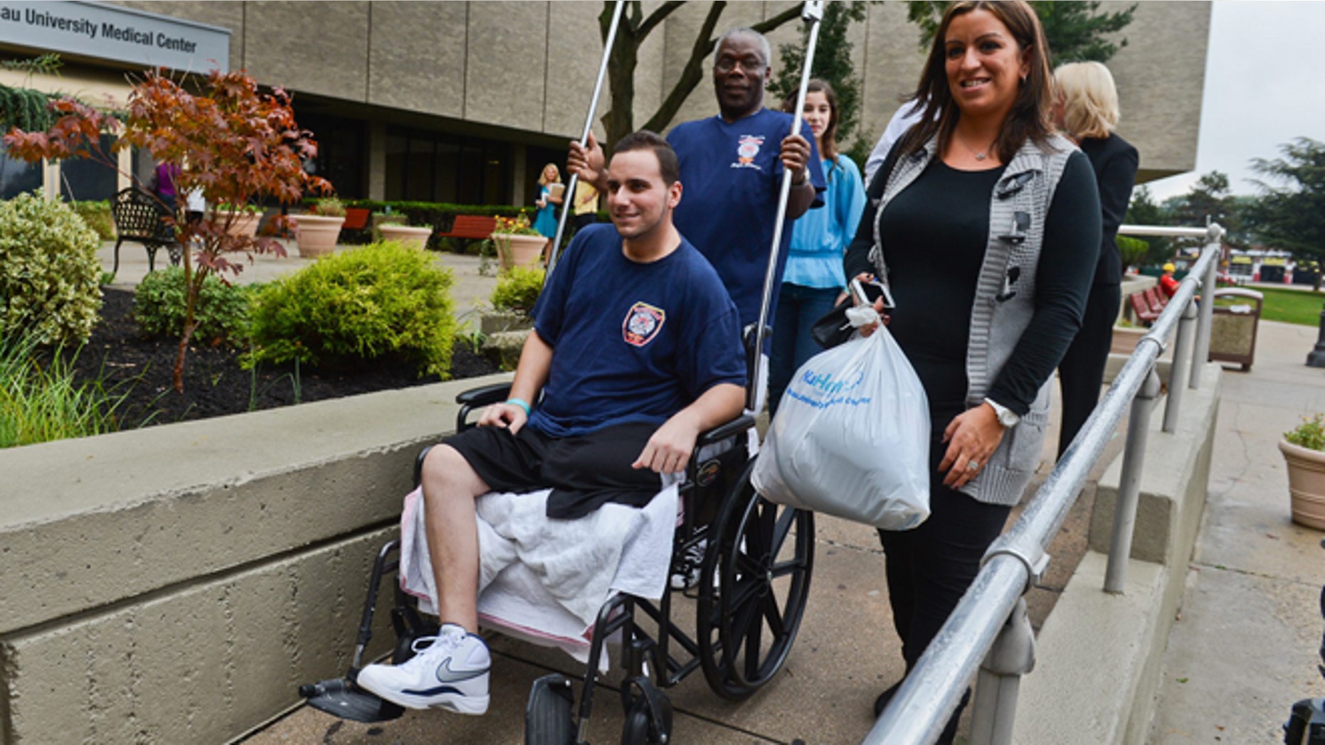 Sept. 28: Ralph Lettieri is led out of Nassau University Medical Center.