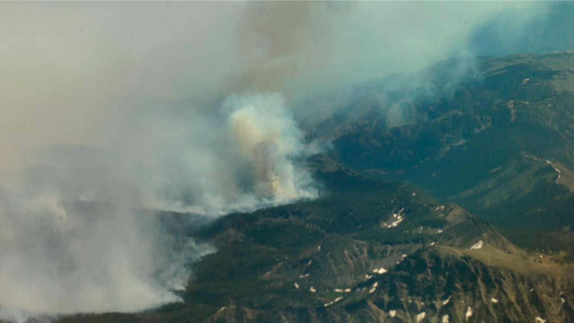 July 18, 2014: The Chiwaukum Creek Fire near Leavenworth, Wash. is viewed from a plane carrying Washington Gov. Jay Inslee on a tour of areas being affected by wildfires. (AP)