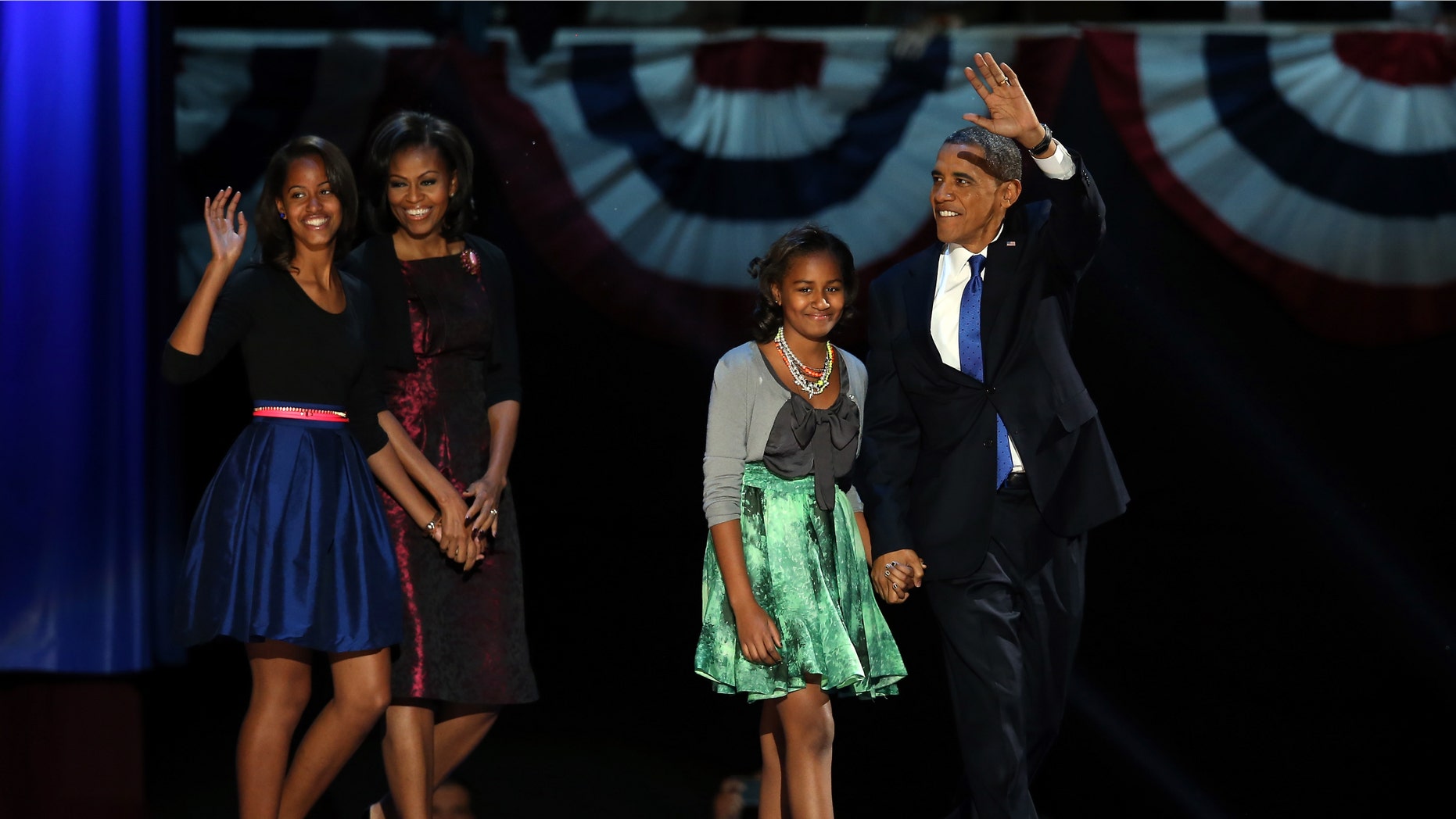CHICAGO, IL - NOVEMBER 06: U.S. President Barack Obama walks on stage with first lady Michelle Obama and daughters Sasha and Malia to deliver his victory speech on election night at McCormick Place November 6, 2012 in Chicago, Illinois. Obama won reelection against Republican candidate, former Massachusetts Governor Mitt Romney. (Photo by Scott Olson/Getty Images)