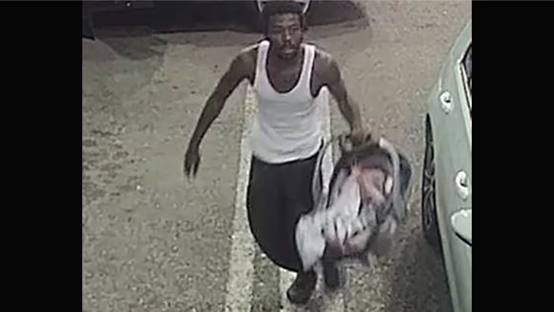 A man suspected of stealing a car at a Florida gas station with an infant inside Tuesday handed the baby to a clerk before taking off, police said.