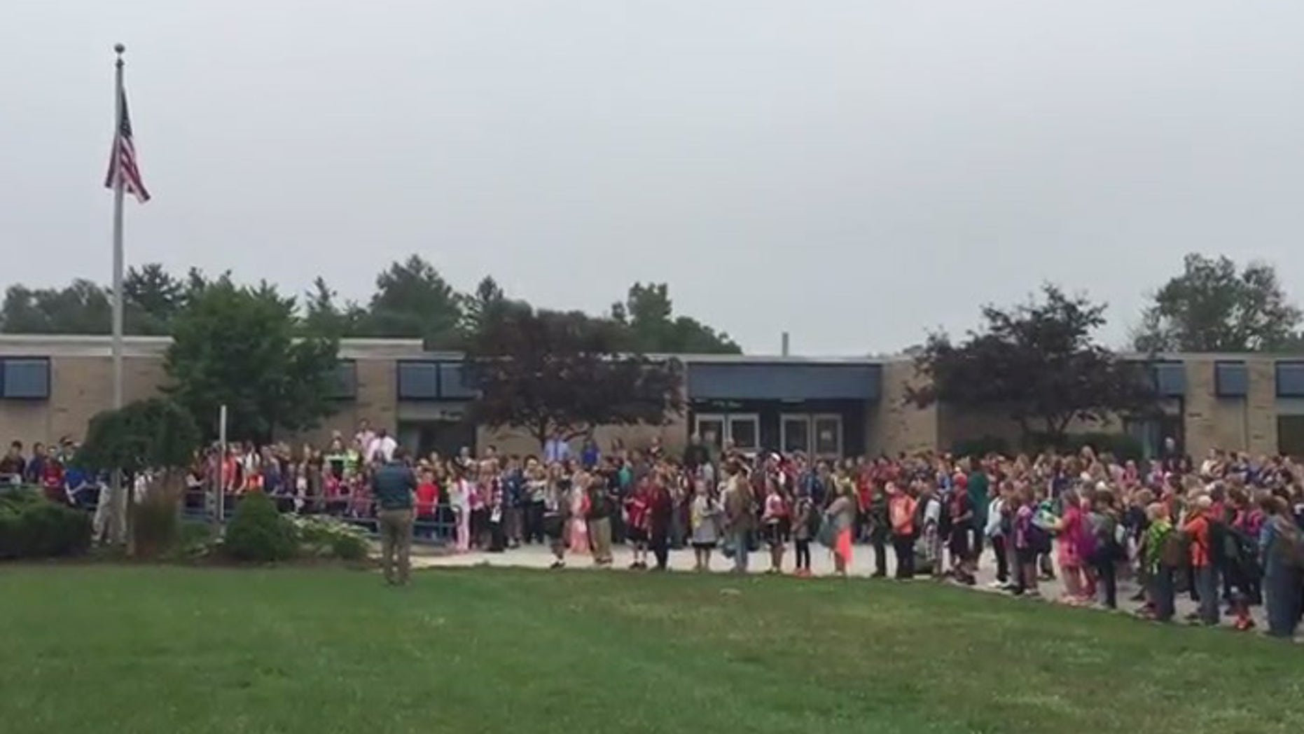 The patriotic moment showed the flag wtill waves proudly at this school.