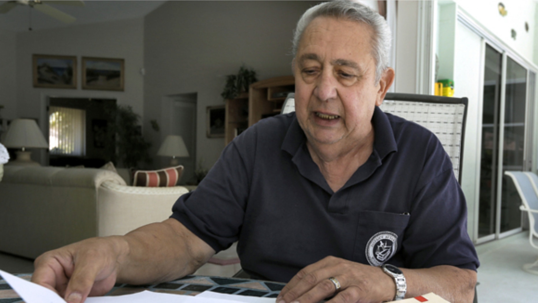 March 21, 2013: Tom Gervasi looks over some his Department of Veterans Affairs rejection letters in Sarasota, Fla.