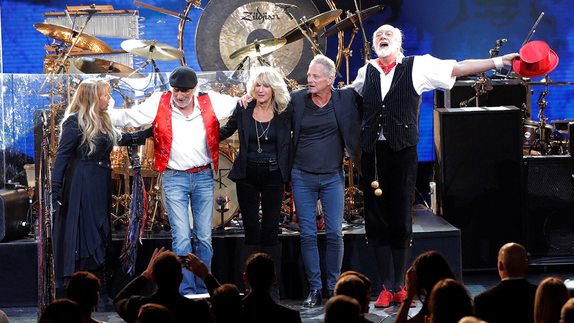 Stevie Nicks, John McVie, Christine McVie, Lindsey Buckingham, and Mick Fleetwood of the group Fleetwood Mac react after performing during the 2018 MusiCares Person of the Year show honoring Fleetwood Mac at Radio City Music Hall in Manhattan. Buckhingham is now suing his former bandmates for kicking off thier tour. <br>