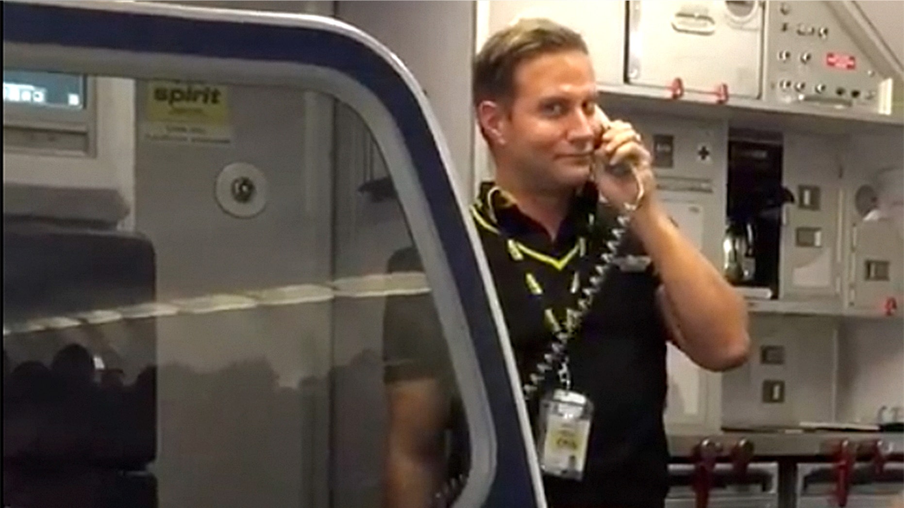 A Spirit flight attendant entertained passengers with some stand-up comedy during a delayed flight.