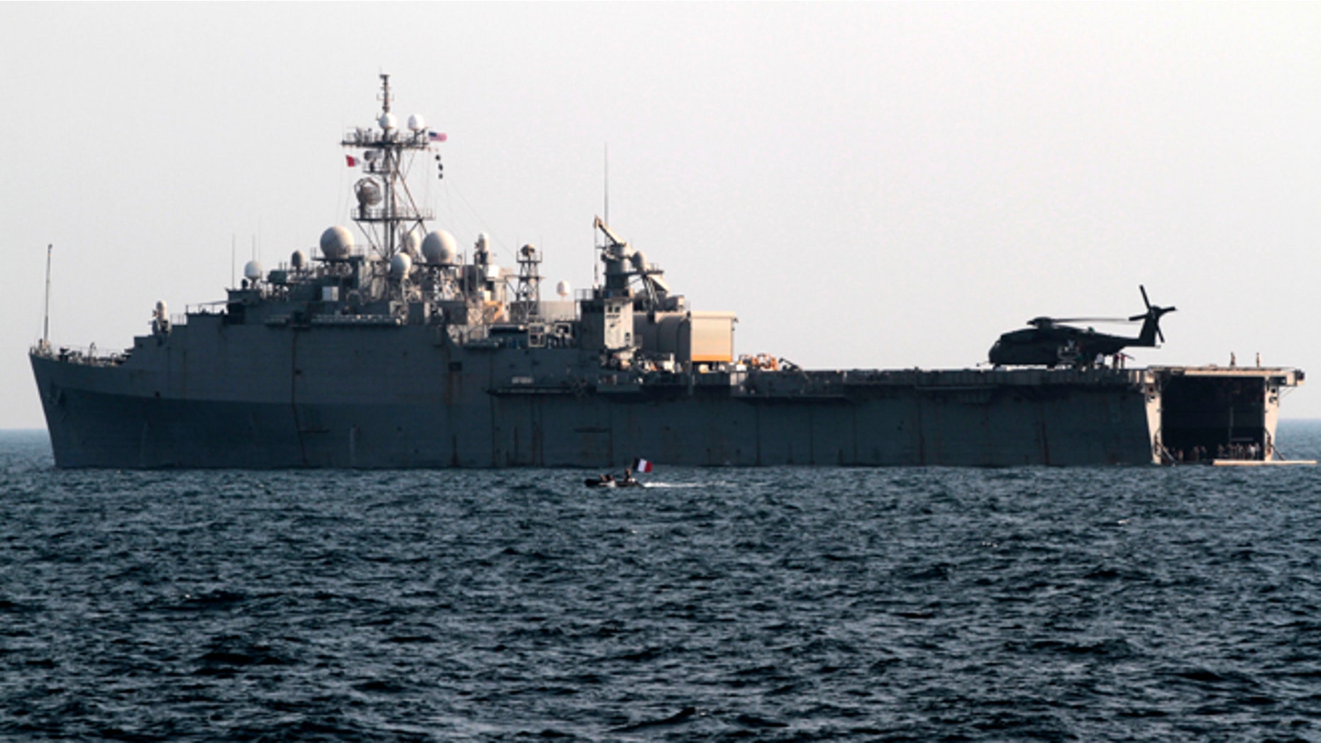 Sept. 21, 2012: A French speedboat deployed from the back of the USS Ponce in the Persian Gulf passes by the U.S. Navy's floating base used to support mine countermeasure operations.
