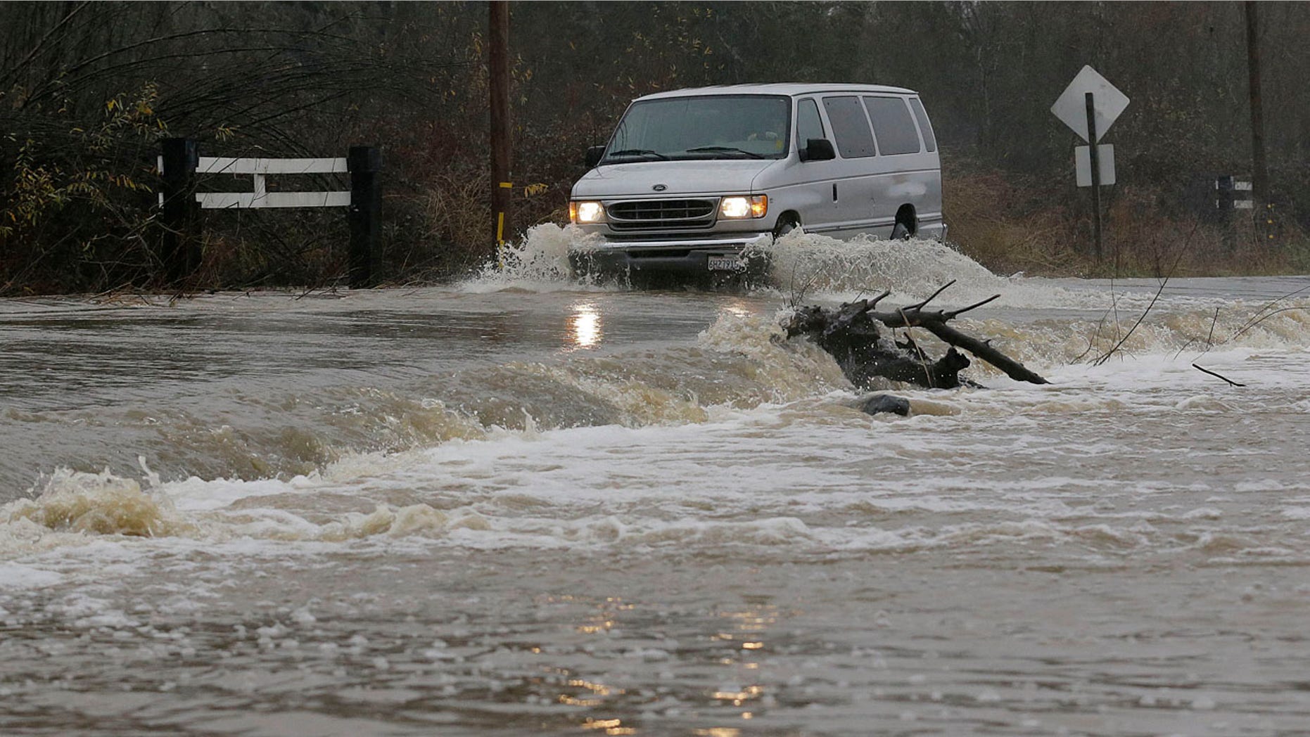 Jan. 7, 2017: A van drives through flooded water on Green Valley Road in Graton, Calif.