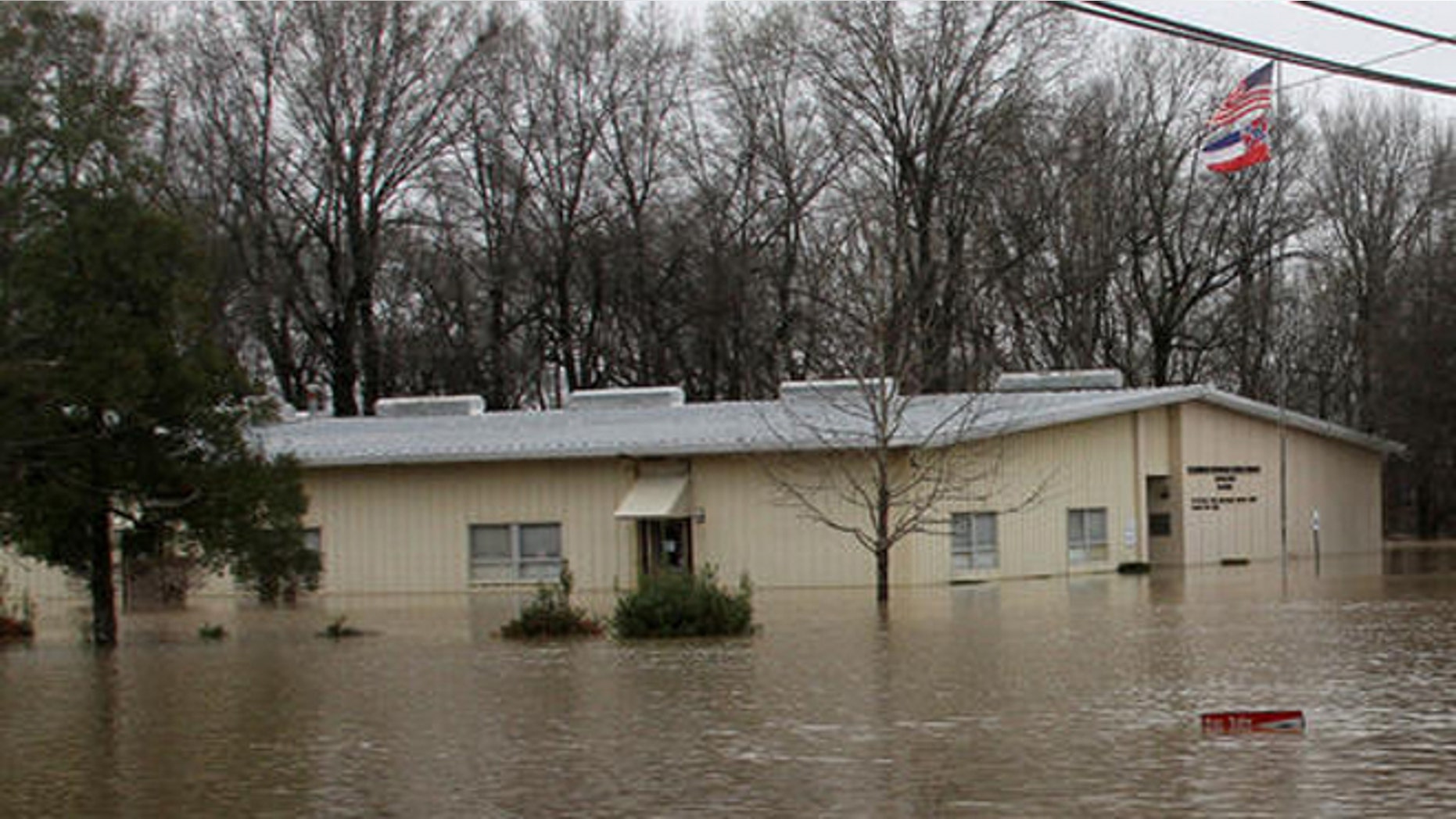 The Clarksdale Municipal School District office is surrounded by several feet of floodwater, Friday, March 11, 2016, in Clarksdale, Mississippi. (Troy Catchings/The Clarksdale Press Register, via AP) MANDATORY CREDIT