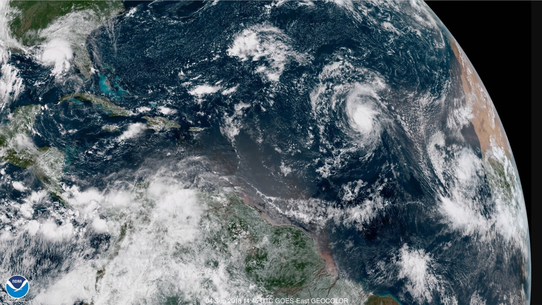 Hurricane Florence can be seen far out over the Atlantic Ocean on Tuesday.
