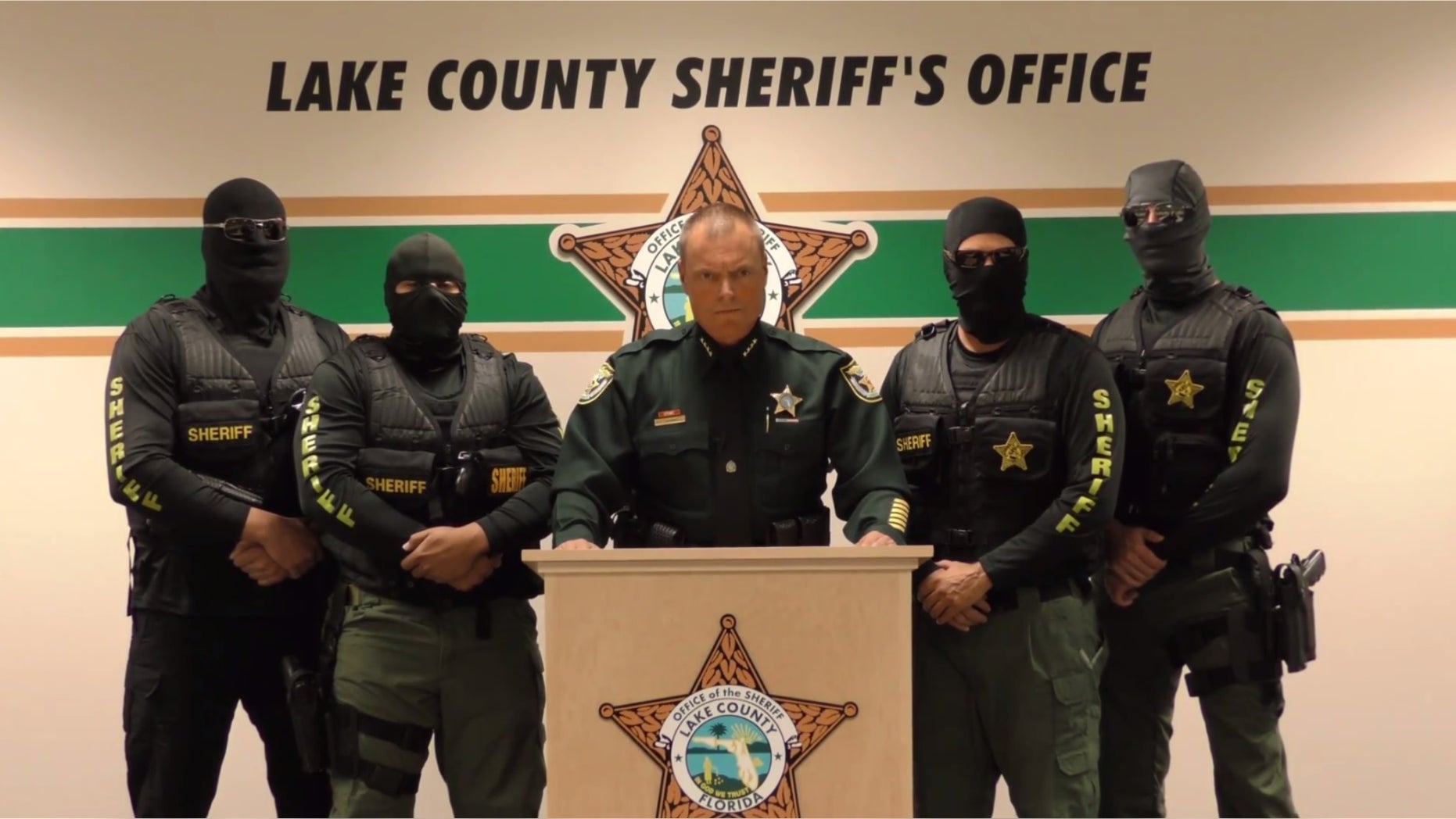 Lake County Sheriff Peyton Grinnell with masked agents in the video.