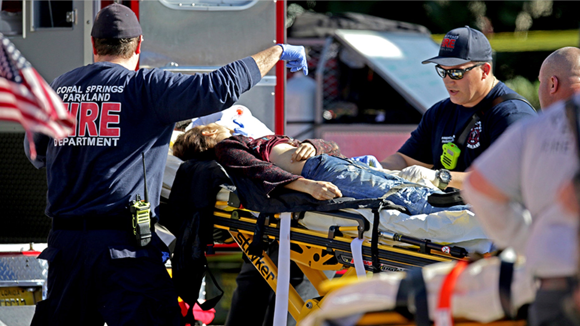 Medical personnel tend to victim following a shooting at Marjory Stoneman Douglas School in Parkland, Florida.