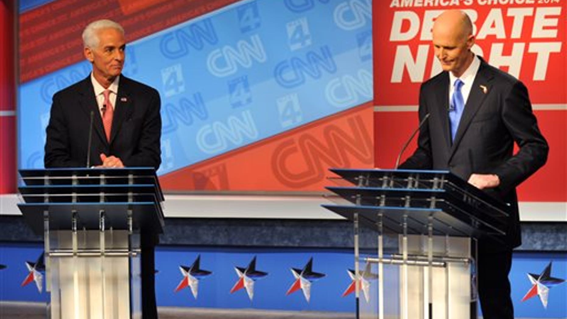Oct. 21, 2014: Democratic candidate Charlie Crist, left, and Republican Gov. Rick Scott wait for their live televised debate.