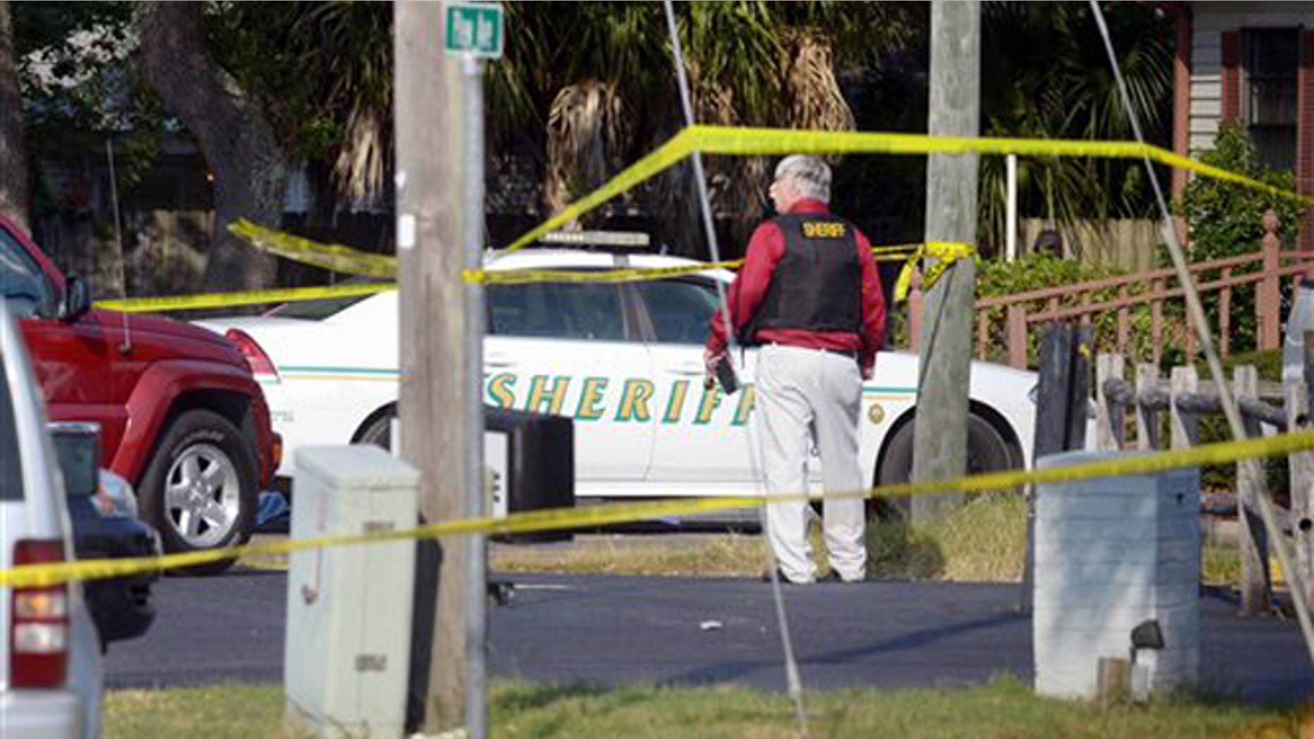Sept. 22, 2015: Okaloosa Sheriff's Office personnel work at the scene of of a law office in Shalimar, Florida where a sheriff's deputy was shot by a man who later fled to the nearby town of Niceville and barricaded himself in a hotel before exchanging gunfire with deputies.