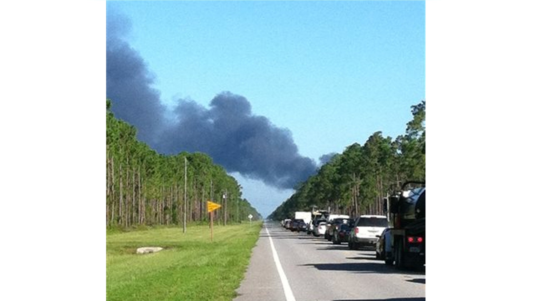 July 17, 2013: In this photo made available by Dylan Dunaway shows heavy smoke near Highway 98 near Mexico Beach, Fla., after a drone crashed on takeoff from Tyndall Air Force Base.