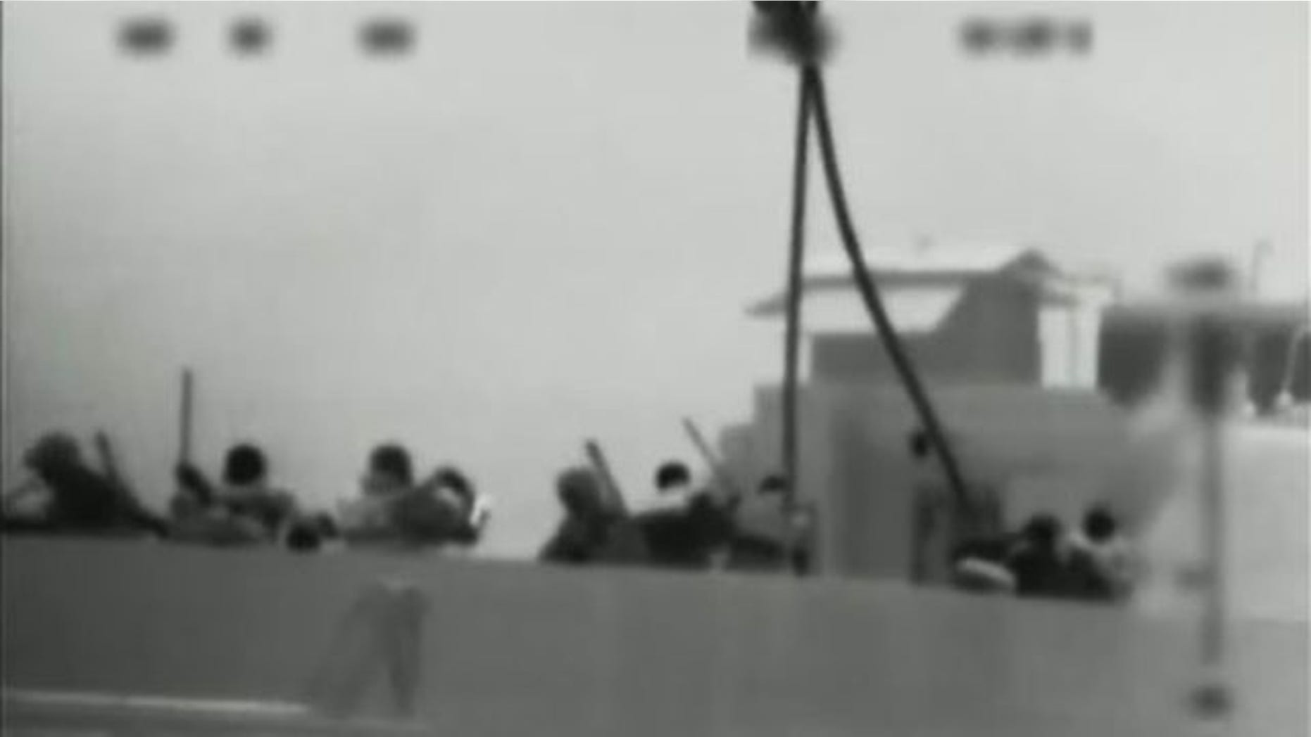 May 31: This image made from video provided by the Israeli Defence Force shows what the IDF says is one of several commandos being dropped onto the Mavi Marmara ship by helicopter in the Mediterranean Sea. Israeli commandos rappelled down to an aid flotilla sailing to thwart a Gaza blockade on Monday, clashing with pro-Palestinian activists on the lead ship in a raid that left at least nine passengers dead.