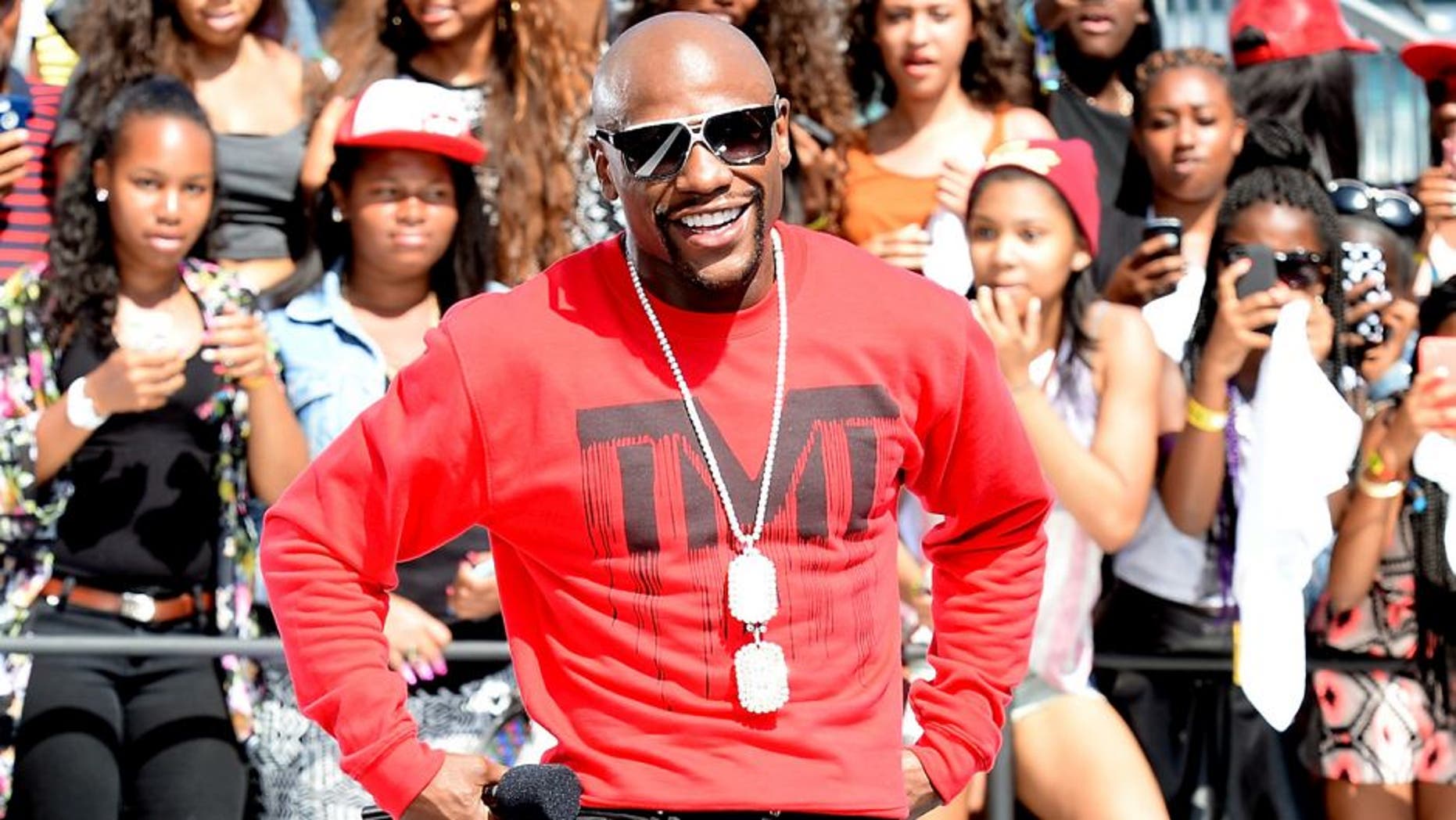 LOS ANGELES, CA - JUNE 28: Professional boxer Floyd Mayweather Jr. speaks onstage at 106 & Park Live Presented By Coca Cola during the 2014 BET Experience at L.A. LIVE on June 28, 2014 in Los Angeles, California. (Photo by Earl Gibson/BET/Getty Images for BET)