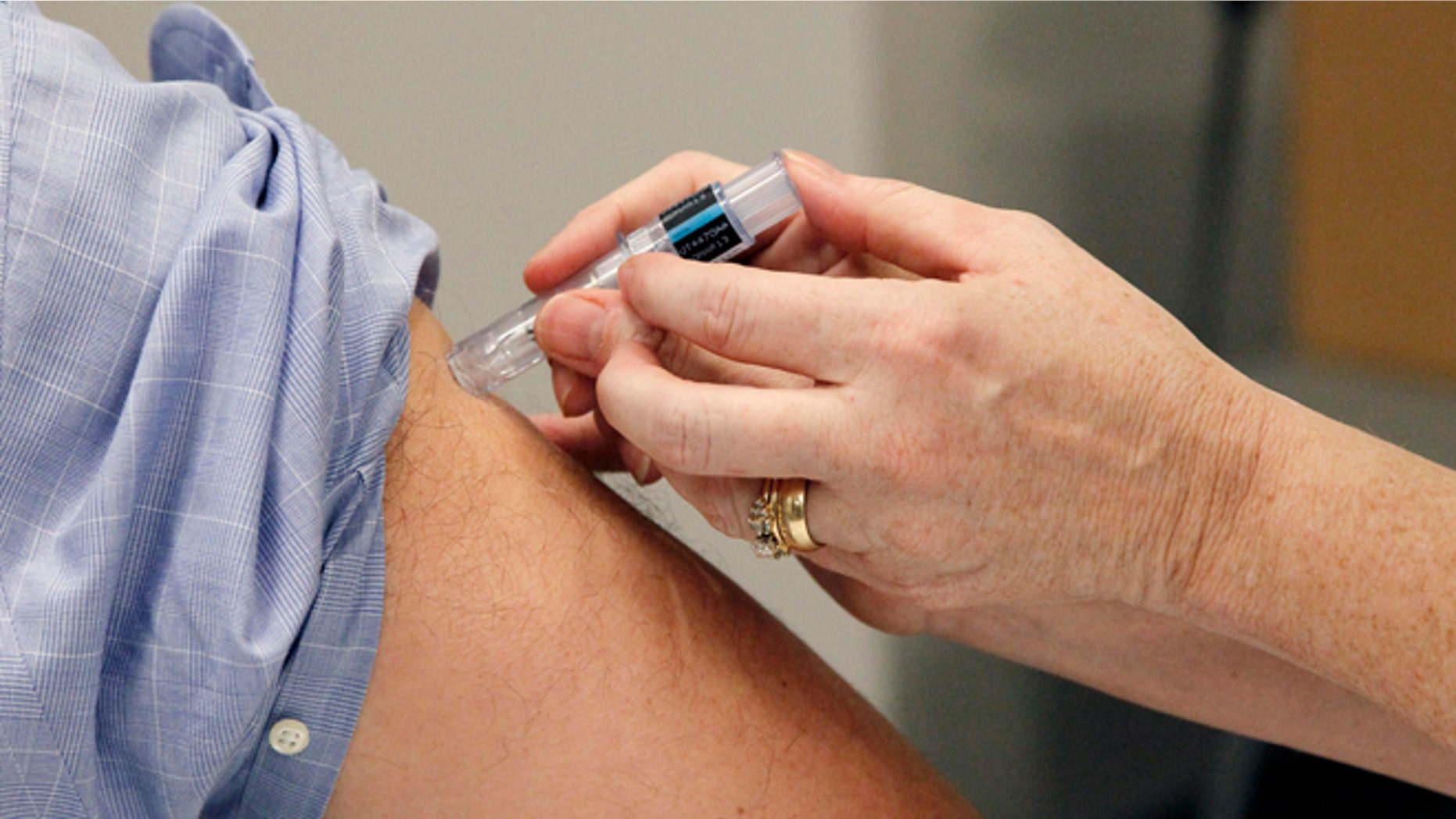 FILE: Oct. 17, 2012: A flu shot is administered in Jackson, Miss.