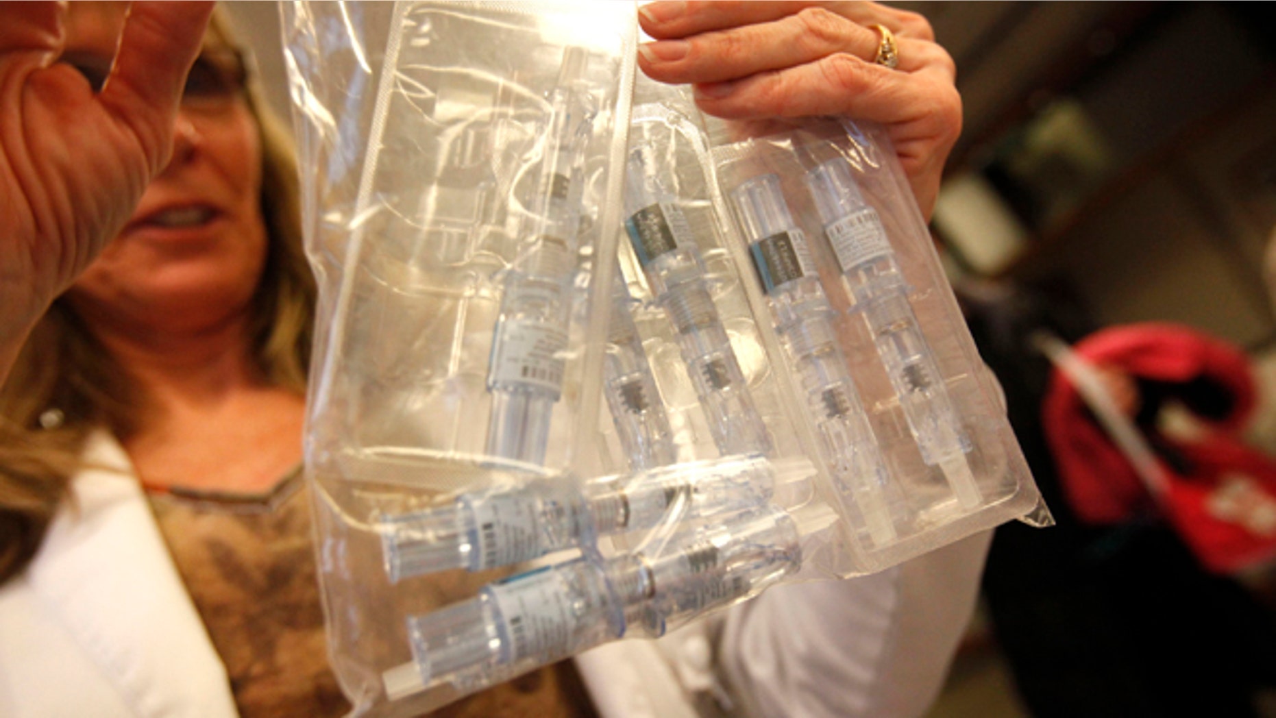 Jan. 11, 2013: Flu vaccines are counted at Borgess Health and Fitness Center flu clinic in Michigan.