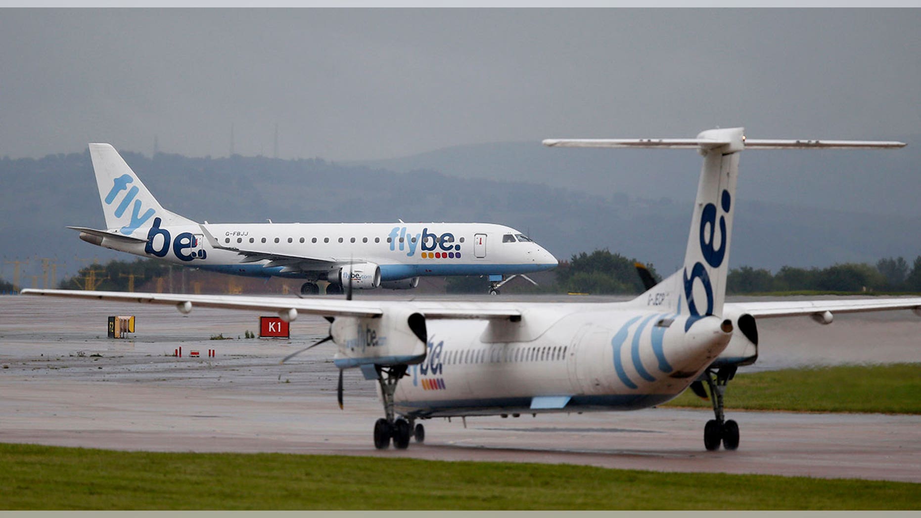 A Flybe flight attendant says a man told her he'd "pee on the floor" if he wasn't allowed to use the bathroom.