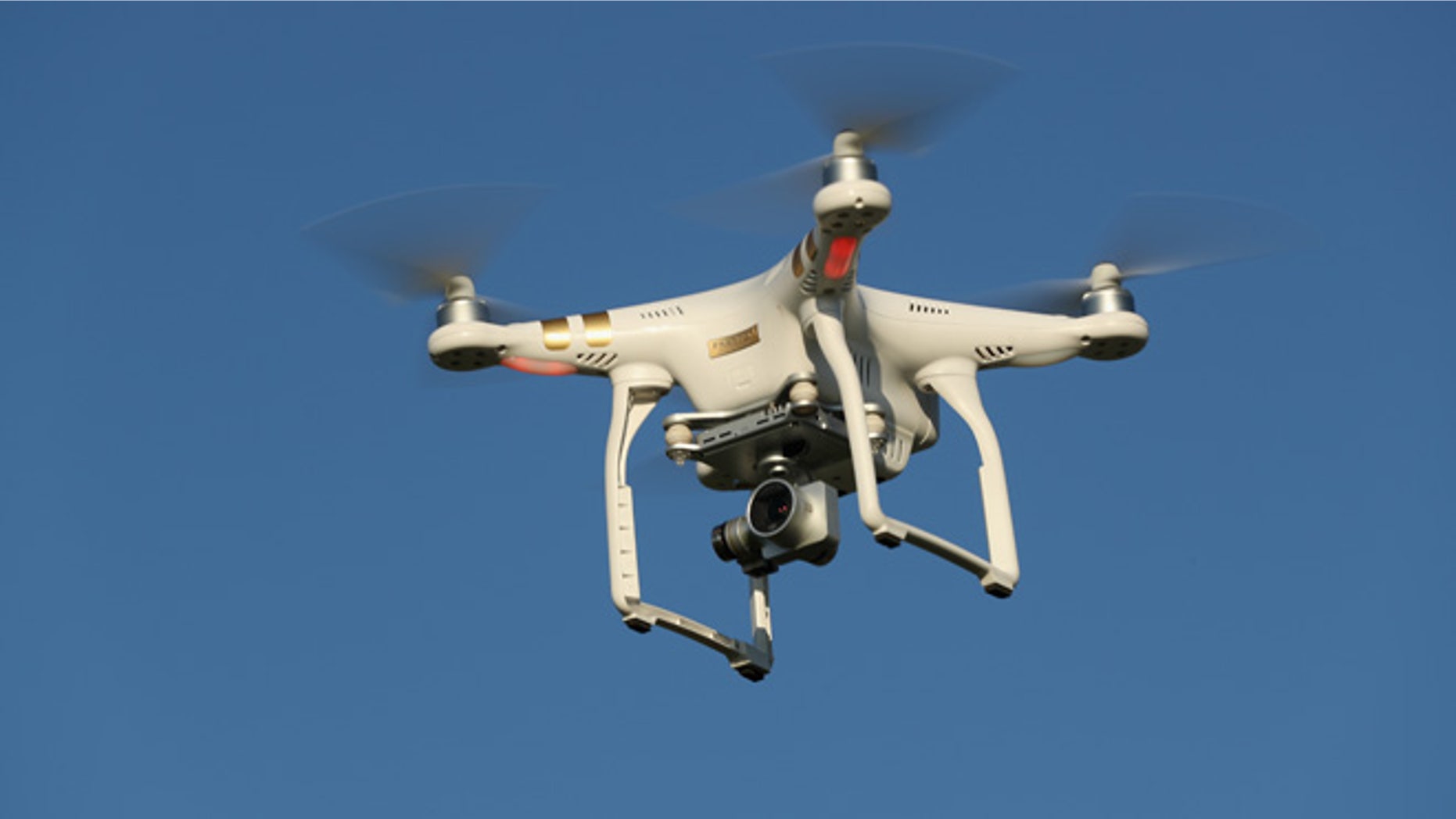 BRUECK, GERMANY - JUNE 08: The photographer's DJI Phantom 3 Pro multirotor drone flies on June 8, 2016 near Brueck, Germany. Countries across Europe are debating legislation to regulate the use of consumer drones. As prices have come down and piloting simplified the market for consumer-oriented drones has risen dramatically with sales of hundreds of thousands of drones expected for coming years. (Photo by Sean Gallup/Getty Images)
