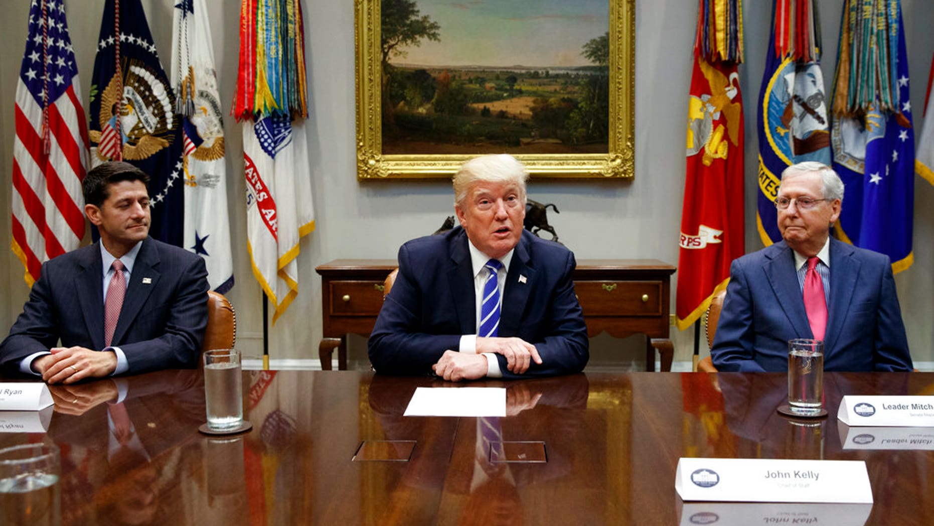 FILE - In this Sept. 5, 2017, file photo, House Speaker Paul Ryan, R-Wis., left, and Senate Majority Leader Mitch McConnell, R-Ky., right, listen as President Donald Trump speaks during a meeting with Congressional leaders and administration officials on tax reform, in the Roosevelt Room of the White House in Washington. Taxes, spending, immigration, and more, top a daunting agenda when Congress returns to Washington on Monday, Nov. 27, 2017. Itâs a critically important moment for the president and his GOP allies controlling Congress, who are still reaching for their first major Capitol Hill win. Tax cuts would fit the bill. (AP Photo/Evan Vucci, File)