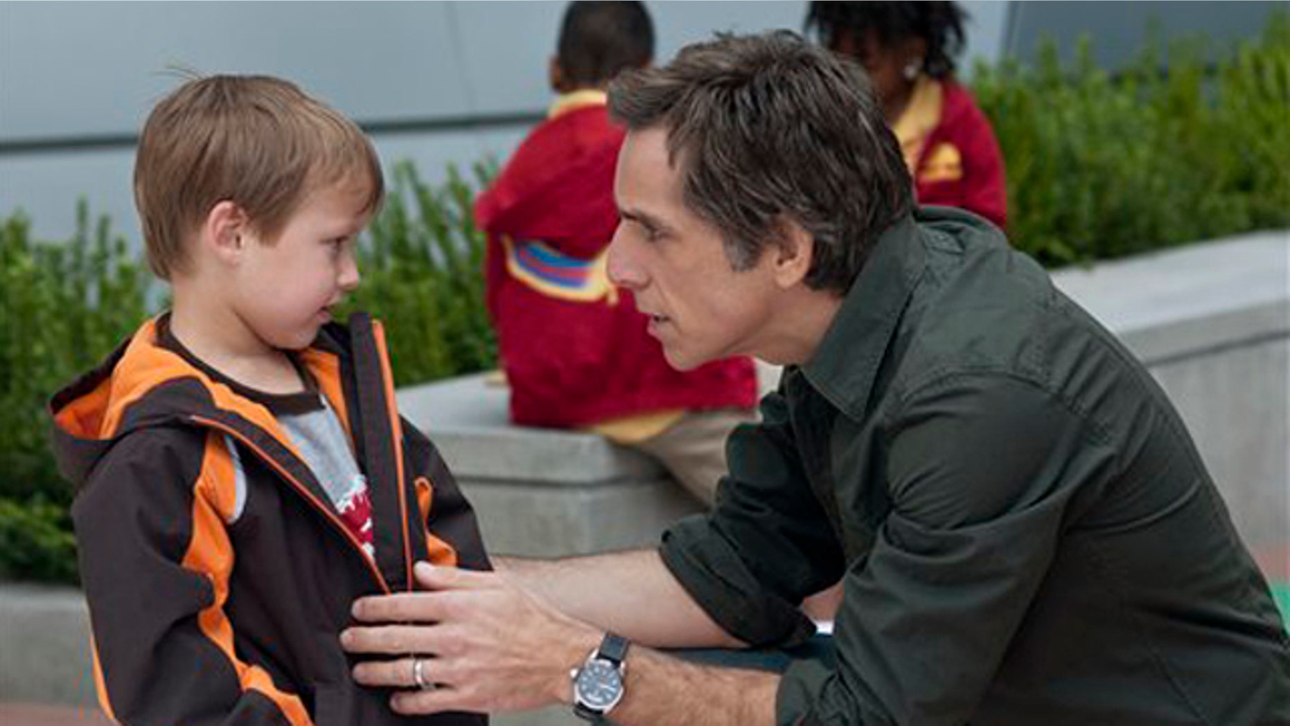In this film publicity image released by Universal Pictures, Colin Baiocchi, left, and Ben Stiller are shown in a scene from "Little Fockers."