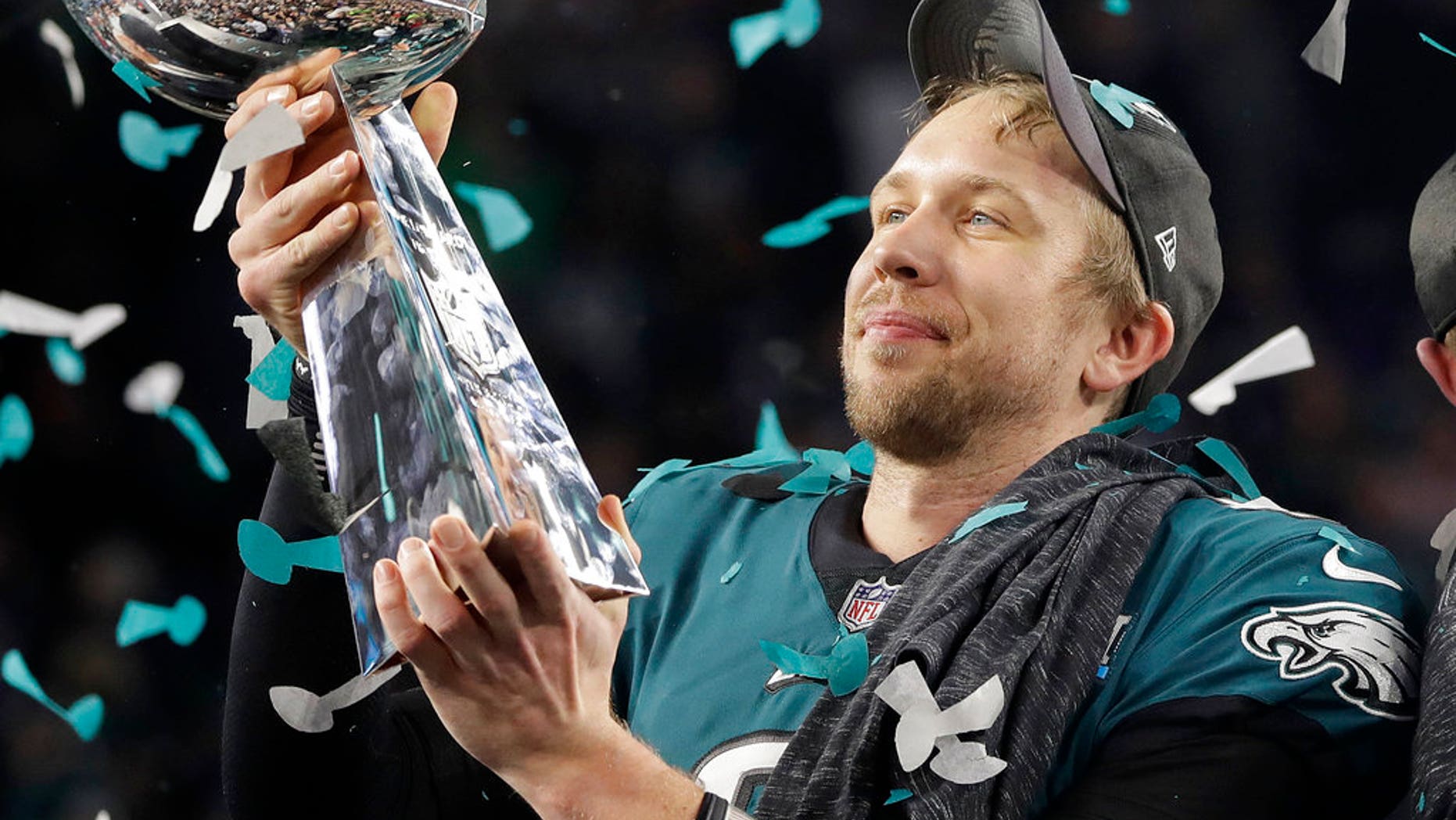 Philadelphia Eagles' Nick Foles holds up the Vince Lombardi Trophy after the NFL Super Bowl 52 football game against the New England Patriots, Sunday, Feb. 4, 2018, in Minneapolis. The Eagles won 41-33. (AP Photo/Matt Slocum)