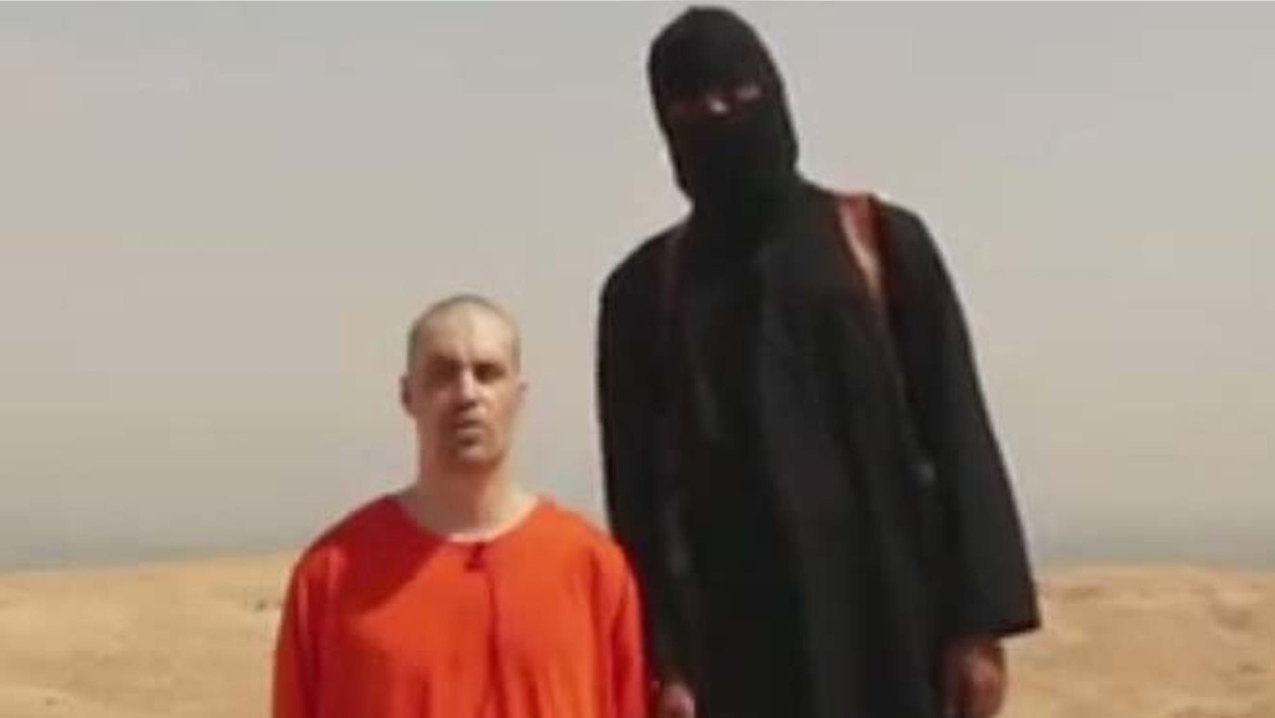 This undated image shows a frame from a video released by Islamic State militants that purports to show the killing of journalist James Foley by the militant group. Foley, from Rochester, N.H., disappeared in 2012 in northern Syria while on assignment for Agence France-Press and the Boston-based media company GlobalPost.