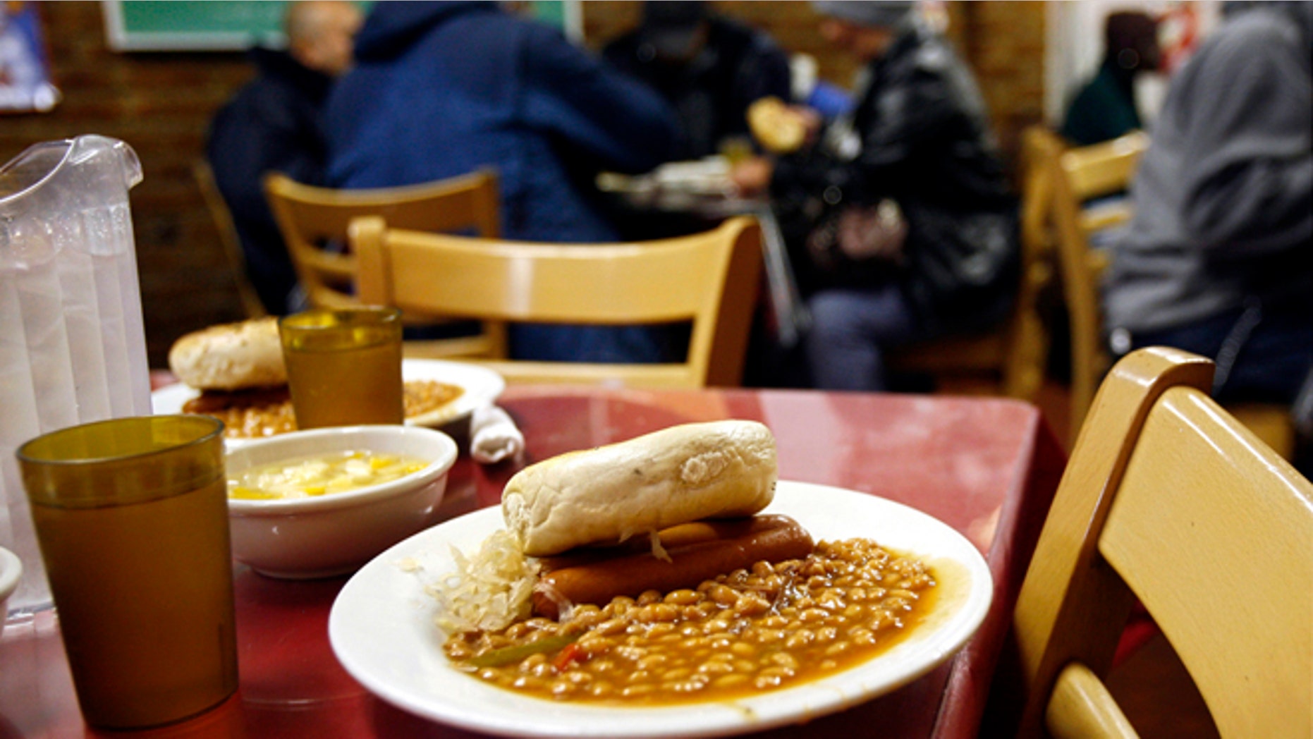 FILE: 2006: A lunch meal at the Part of the Solution soup kitchen and food pantry in the Bronx borough of New York. Nearly one in 10 Americans at the time were expected to rely on food stamps.