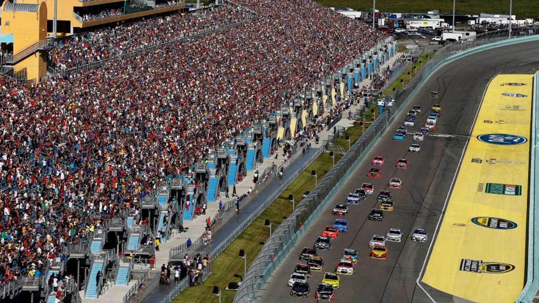 HOMESTEAD, FL - NOVEMBER 16: Jeff Gordon, driver of the #24 Drive To End Hunger Chevrolet, and Kurt Busch, driver of the #41 Haas Automation Chevrolet, lead the field on the first lap of the NASCAR Sprint Cup Series Ford EcoBoost 400 at Homestead-Miami Speedway on November 16, 2014 in Homestead, Florida. (Photo by Brian Lawdermilk/Getty Images)