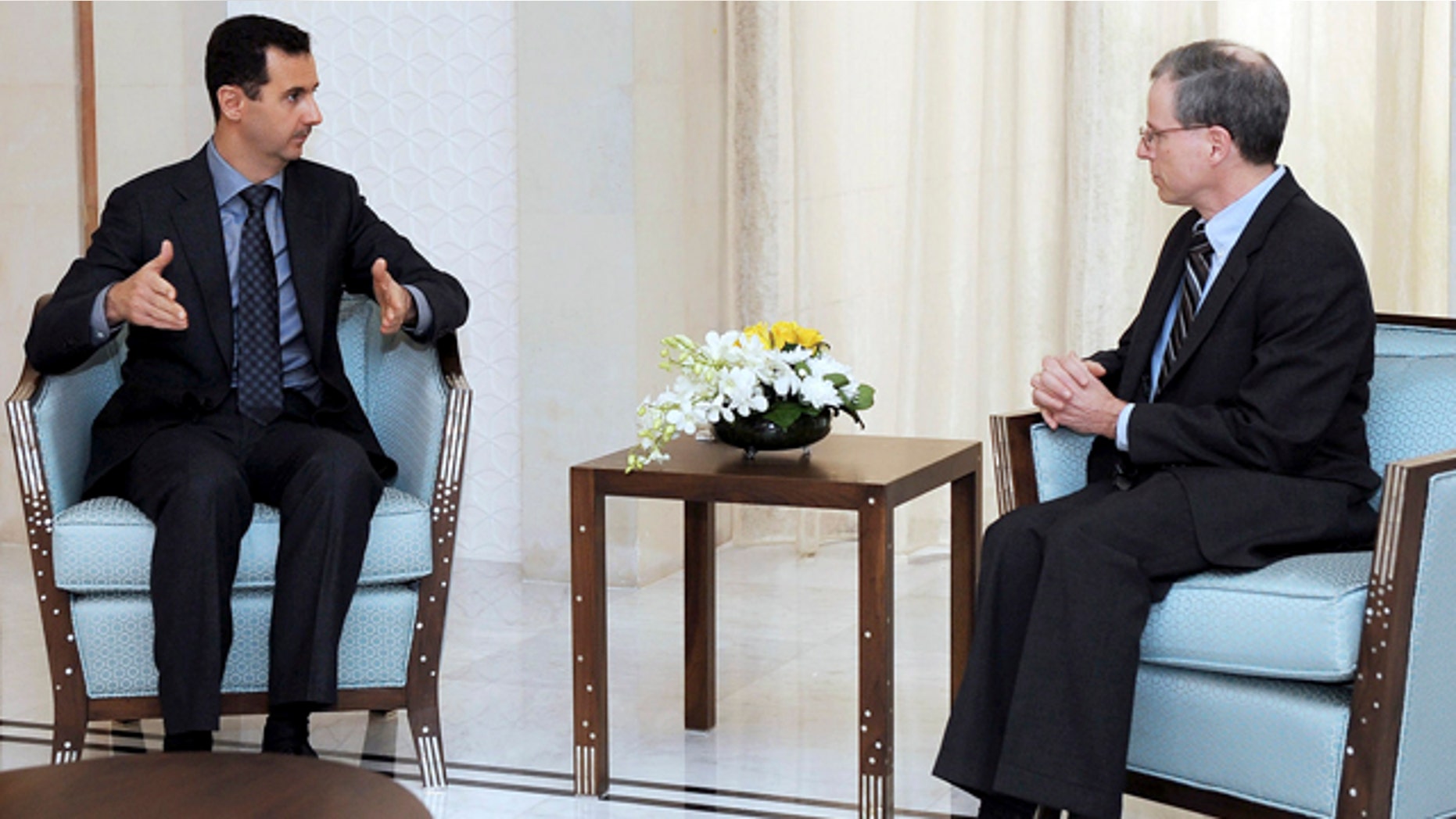 Jan. 27, 2011: FILE - In this file photo released by the Syrian official news agency SANA, Syrian President Bashar Assad, left, meets with Robert Ford, the U.S. ambassador to Syria, in Damascus, Syria.