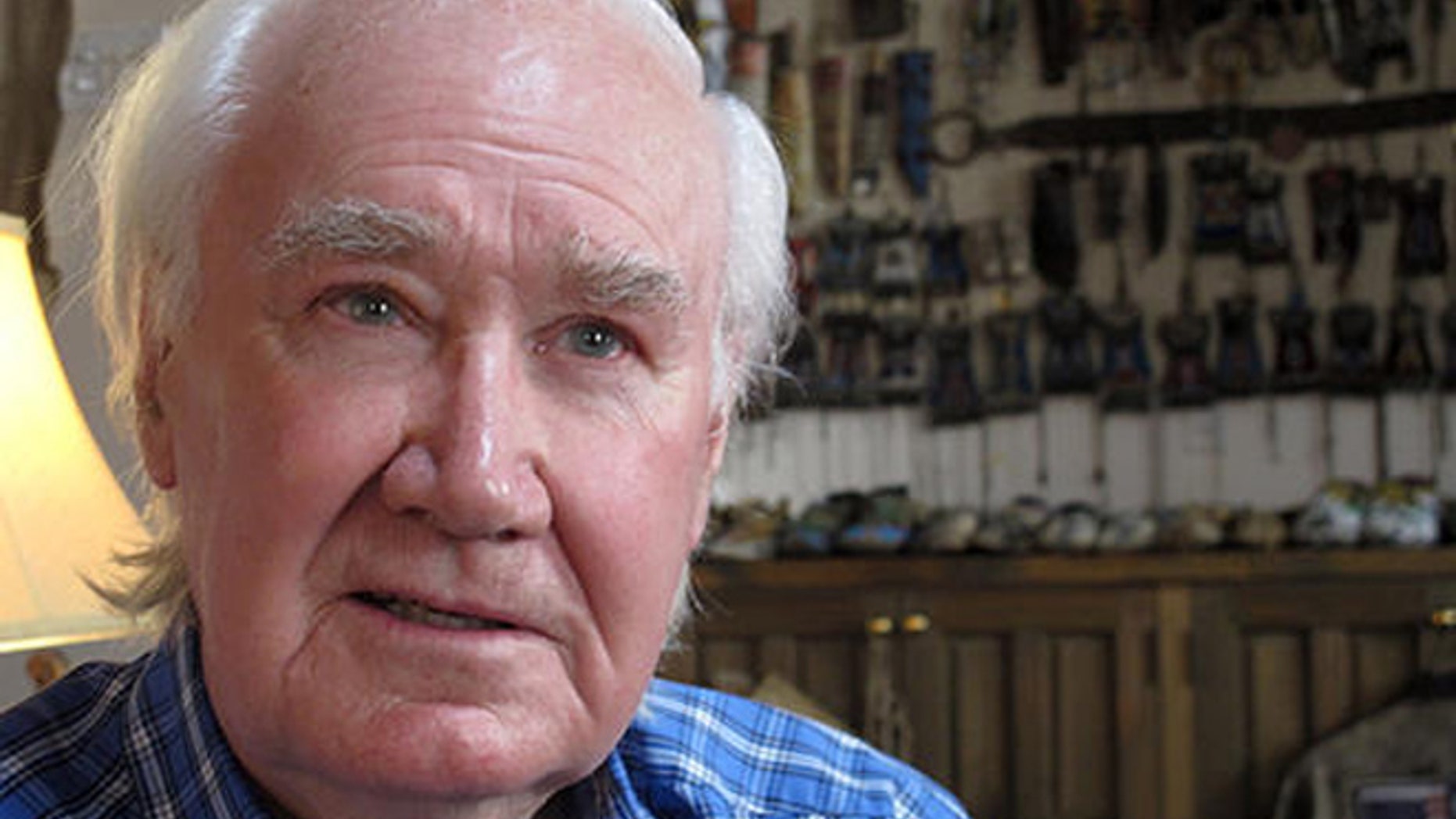 In this March 22, 2013 file photo, antiquities dealer and author Forrest Fenn sits in his home in Santa Fe, N.M.