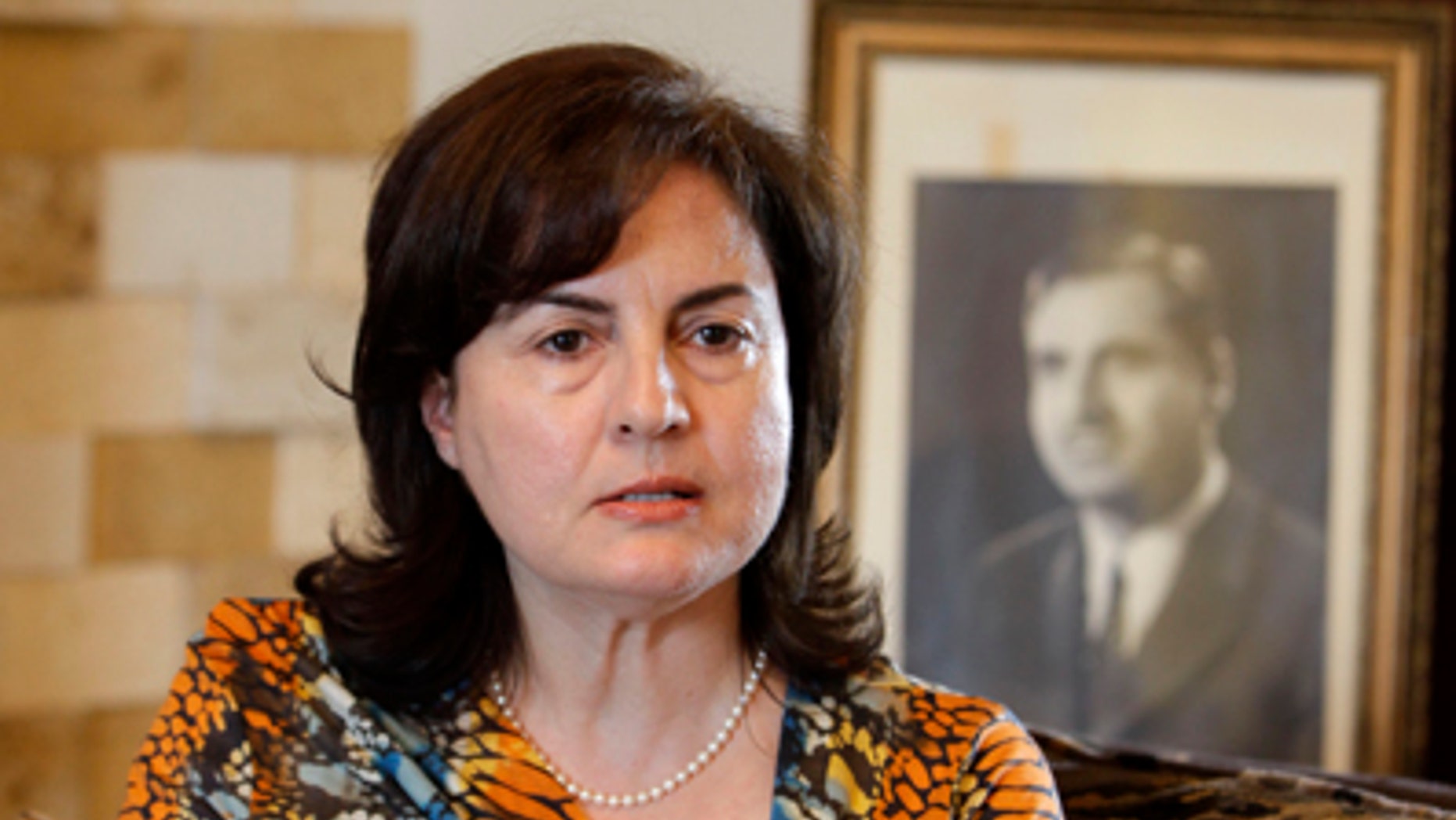 Oct. 18, 2011: Rajaa Sharafeddine, daughter of former Syrian Vice President Shibli al-Aisamy, who was kidnapped during a visit to Lebanon in May, speaks during an interview in her home in the mountain town of Aley, Lebanon. Sharafeddine said her father is believed to be secretly imprisoned by the Syrian regime as it tries to crush a 7-month-old uprising.