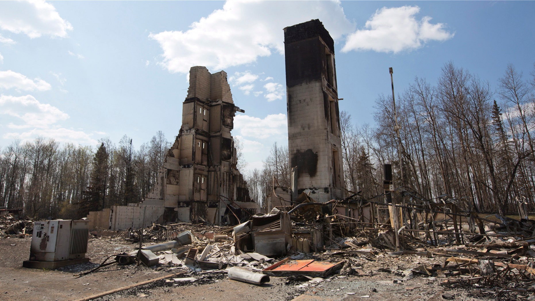 May 13, 2016: A burned building stands among charred rubble in the neighborhood of Abasand in wildfire-ravaged Fort McMurray, Alberta
