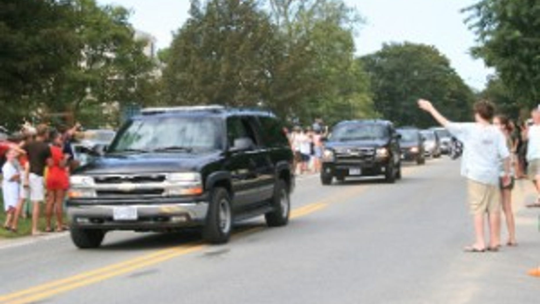 The President's motorcade makes its way past supporters. Fox Photo by Janice Haefeli